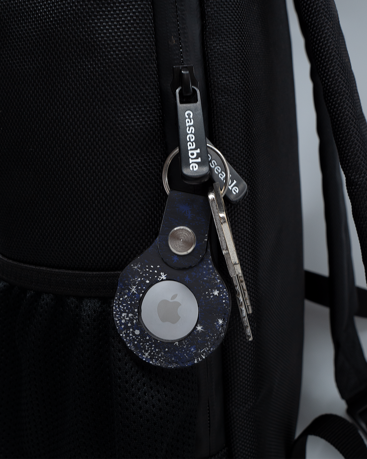 AirTag Holder with design Starry Night Sky attached to a bag