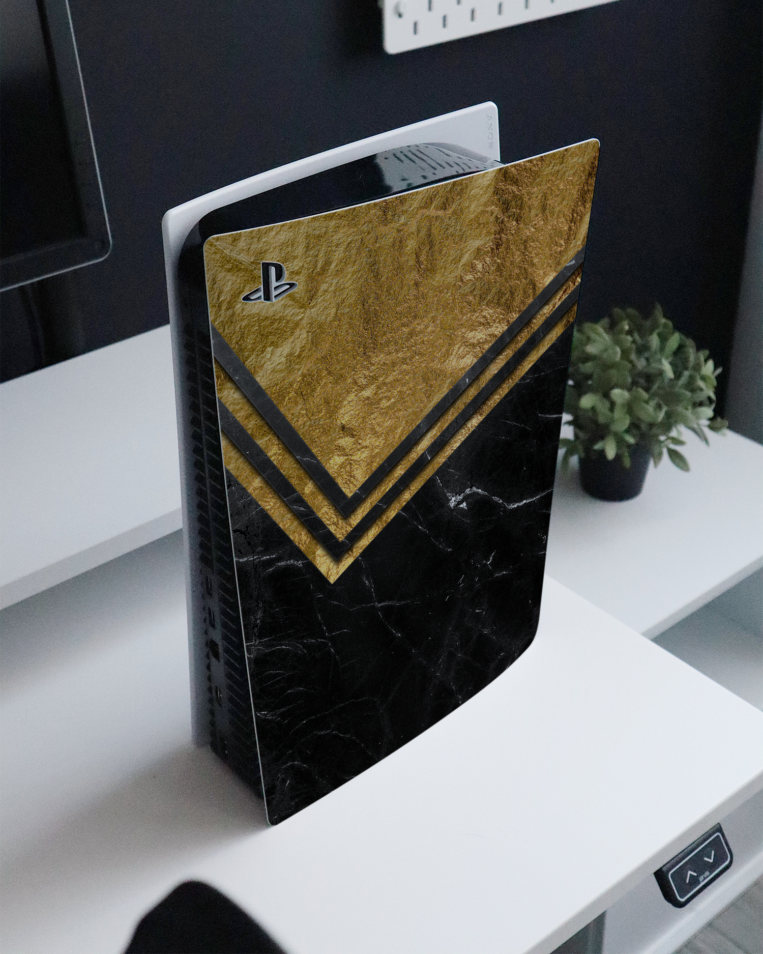 Gold Marble Console Skin for Sony PlayStation 5 Digital Edition standing on a sideboard 
