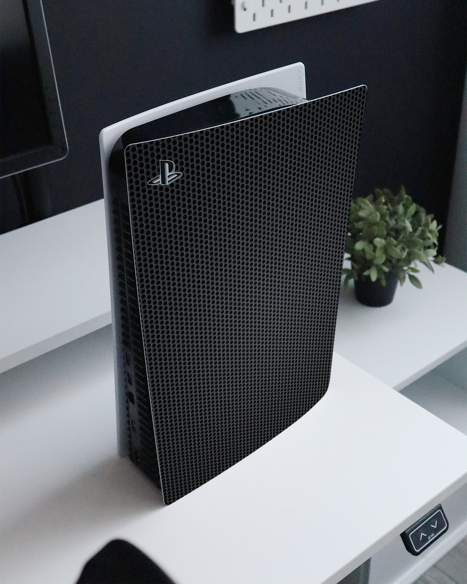 Carbon II Console Skin for Sony PlayStation 5 Digital Edition standing on a sideboard 