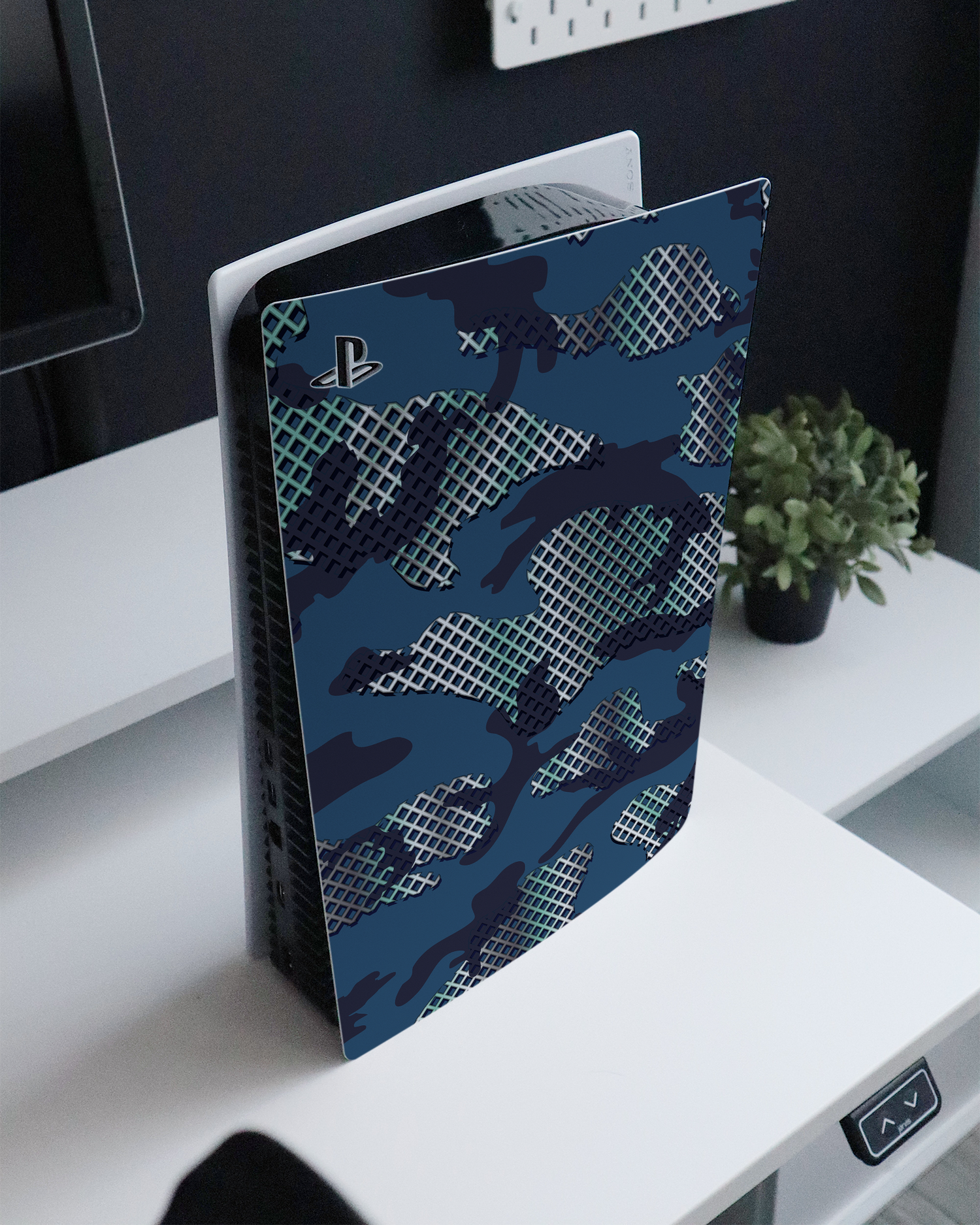 Fall Camo I Console Skin for Sony PlayStation 5 Digital Edition standing on a sideboard 