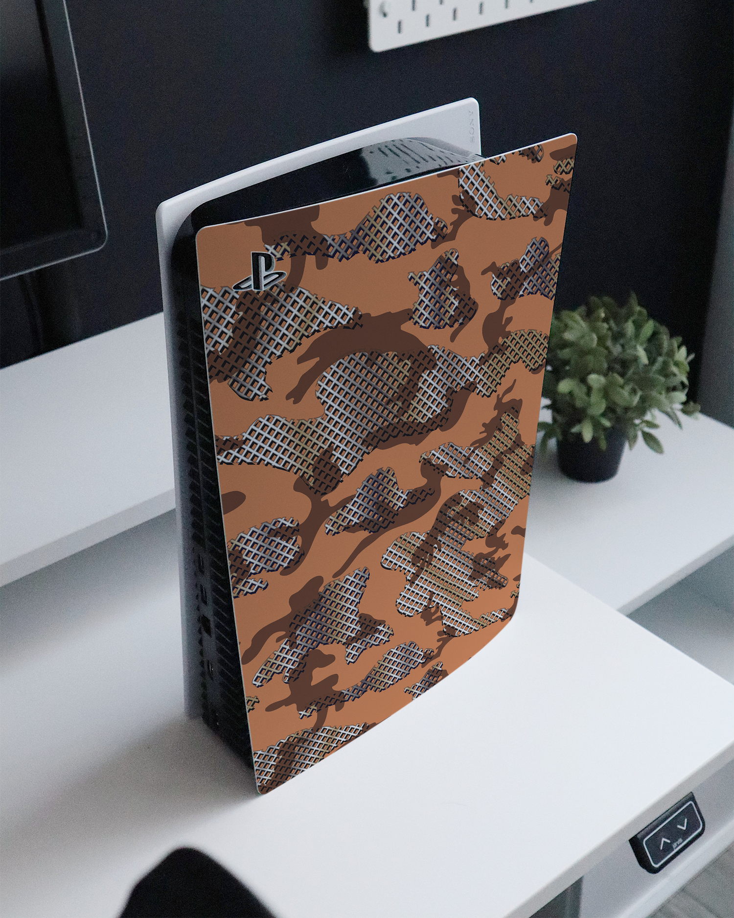 Fall Camo IV Console Skin for Sony PlayStation 5 Digital Edition standing on a sideboard 