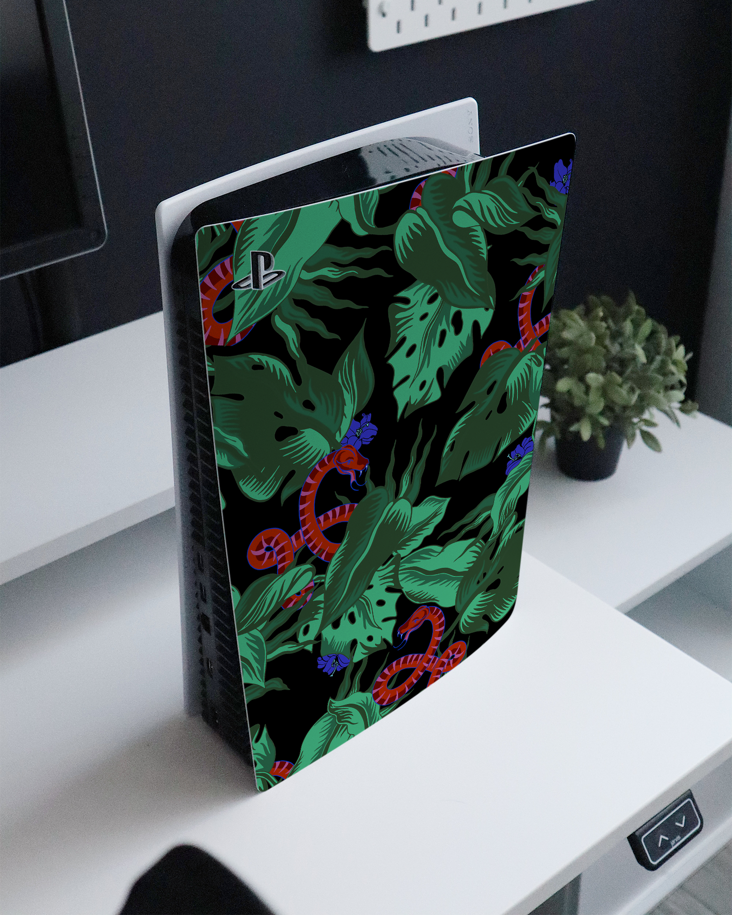 Tropical Snakes Console Skin for Sony PlayStation 5 Digital Edition standing on a sideboard 
