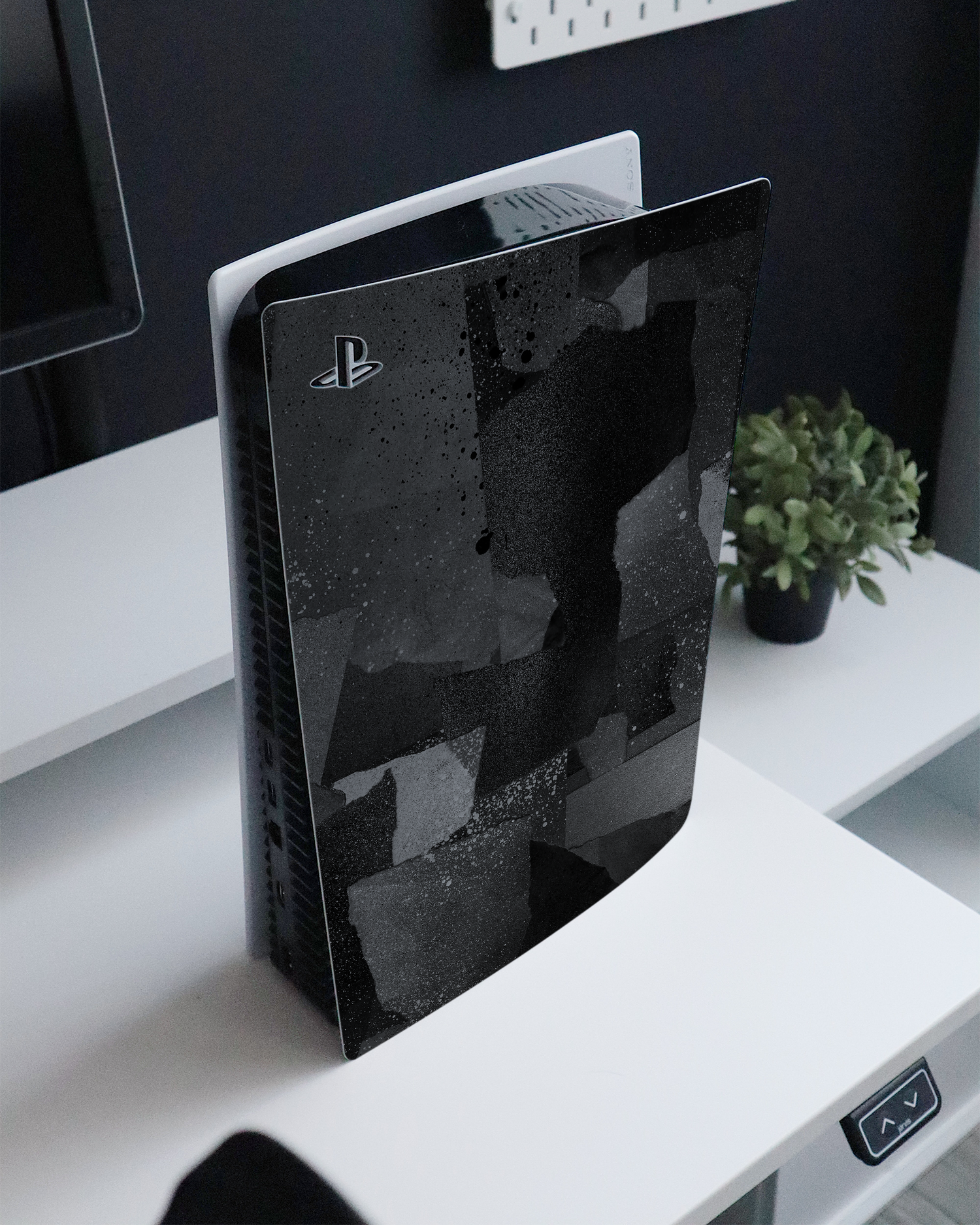 Torn Paper Collage Console Skin for Sony PlayStation 5 Digital Edition standing on a sideboard 