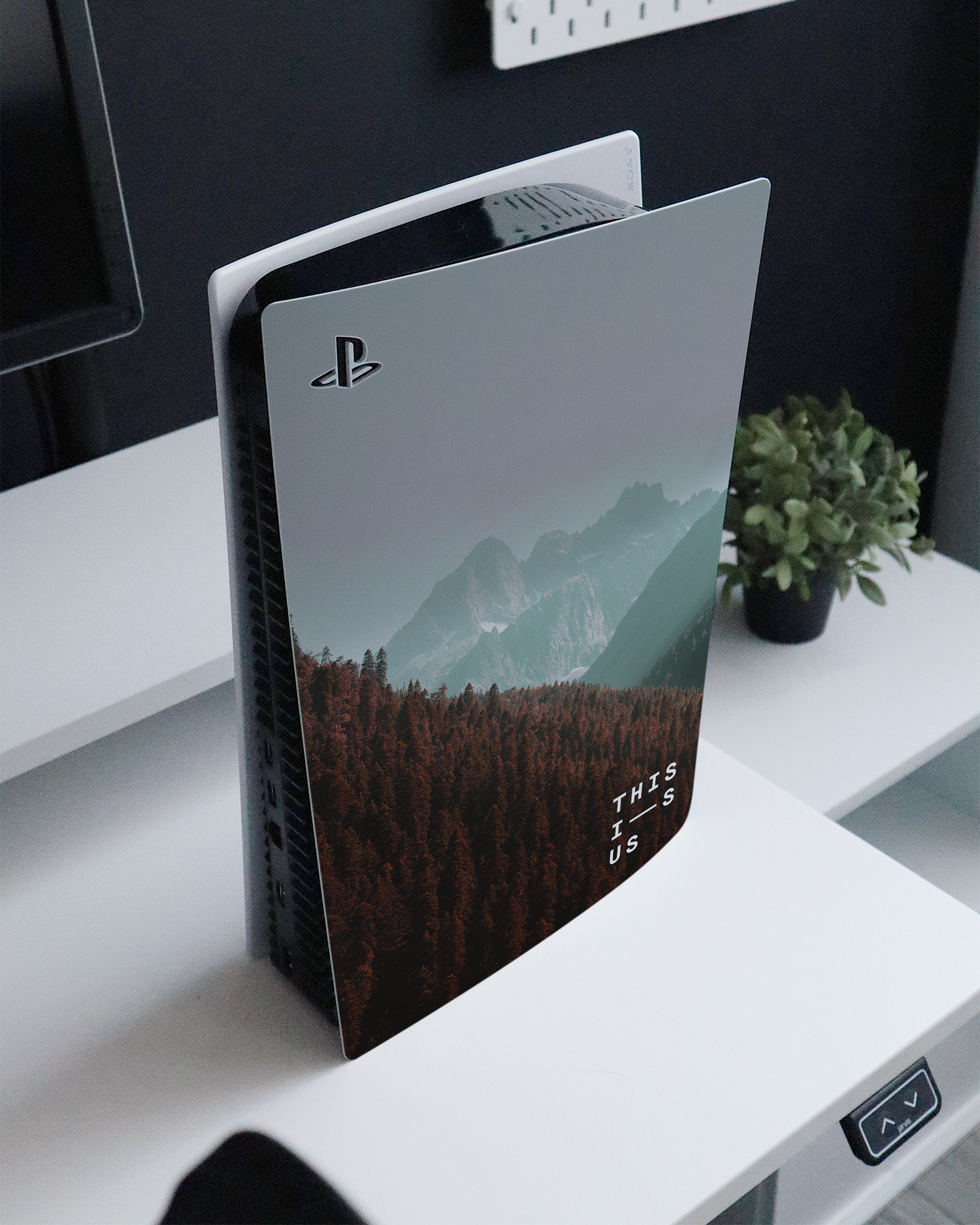 Into the Woods Console Skin for Sony PlayStation 5 standing on a sideboard 