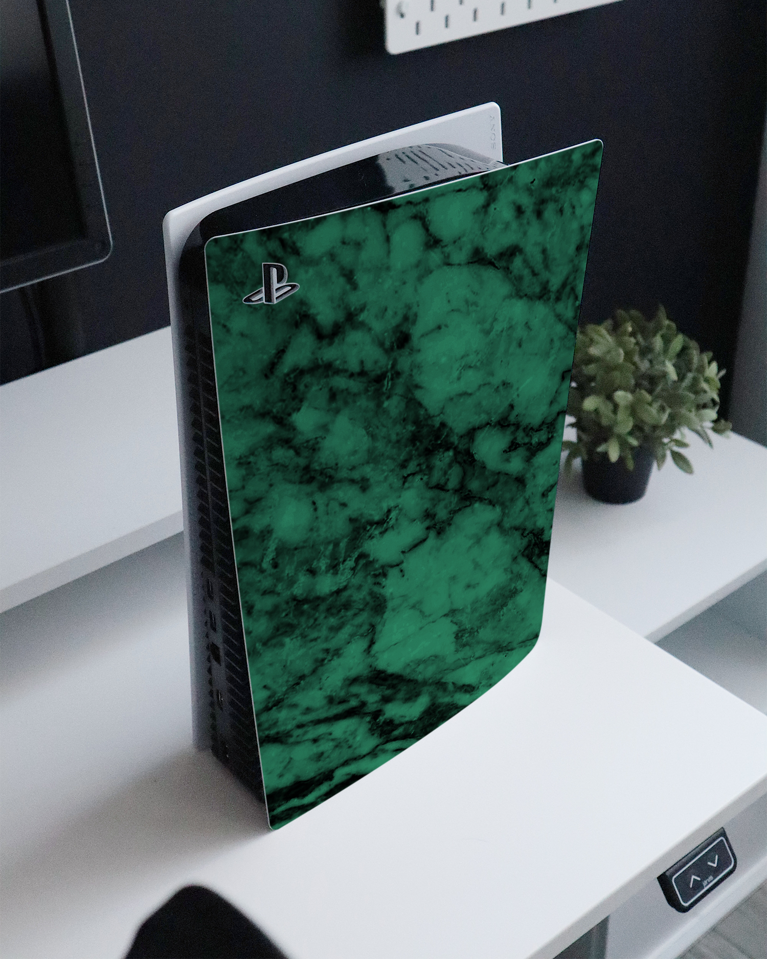 Green Marble Console Skin for Sony PlayStation 5 standing on a sideboard 