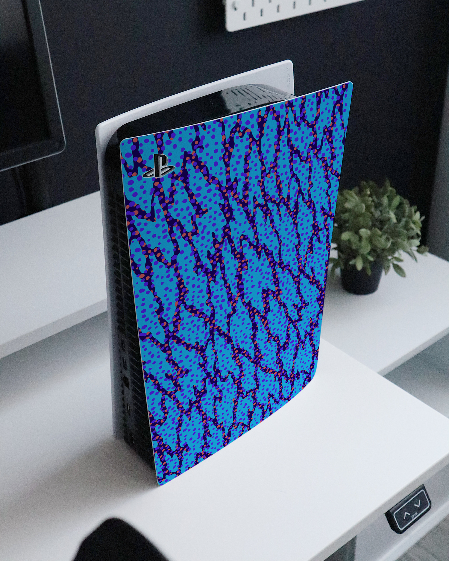 Electric Ocean Console Skin for Sony PlayStation 5 standing on a sideboard 