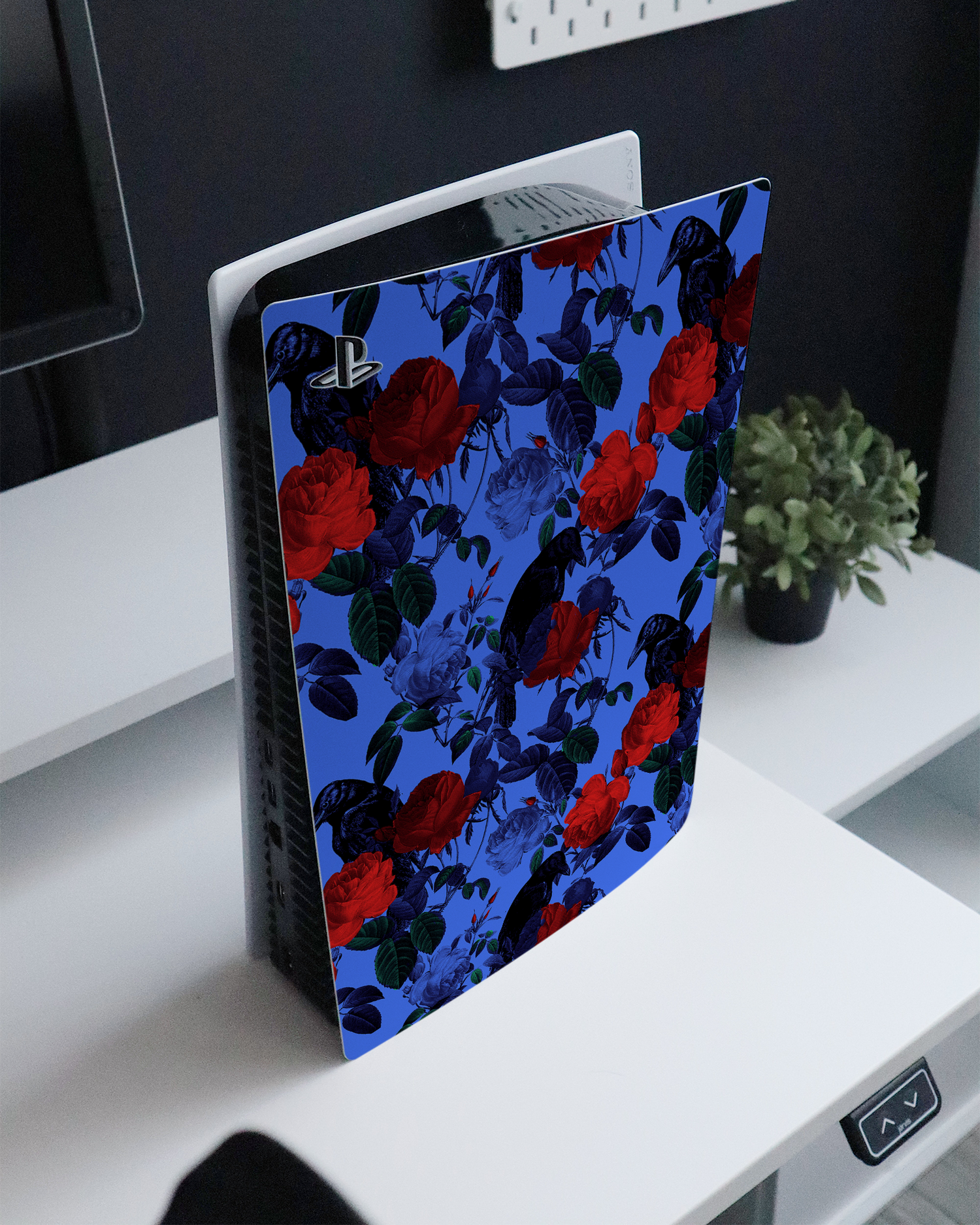 Roses And Ravens Console Skin for Sony PlayStation 5 standing on a sideboard 