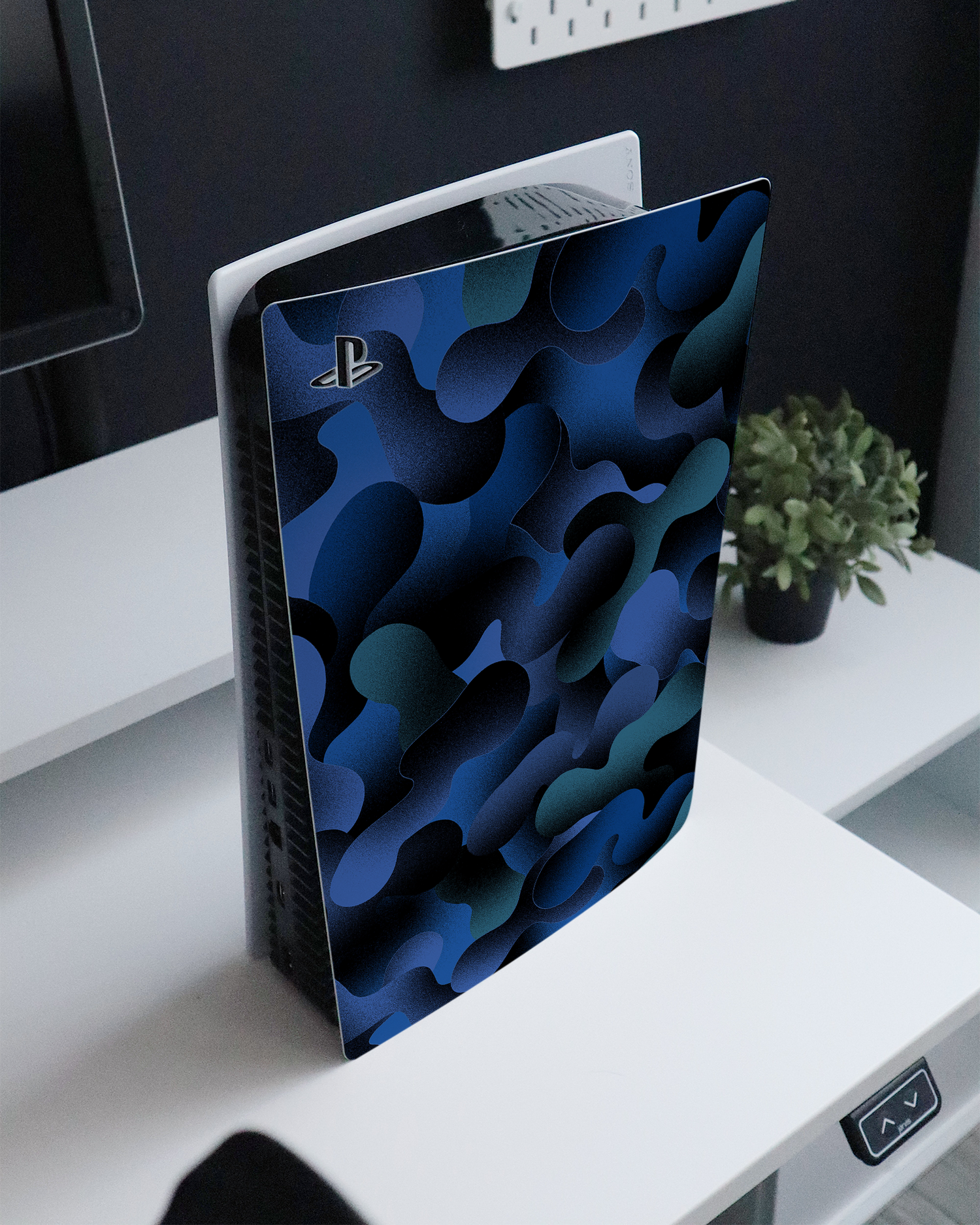 Night Moves Console Skin for Sony PlayStation 5 standing on a sideboard 
