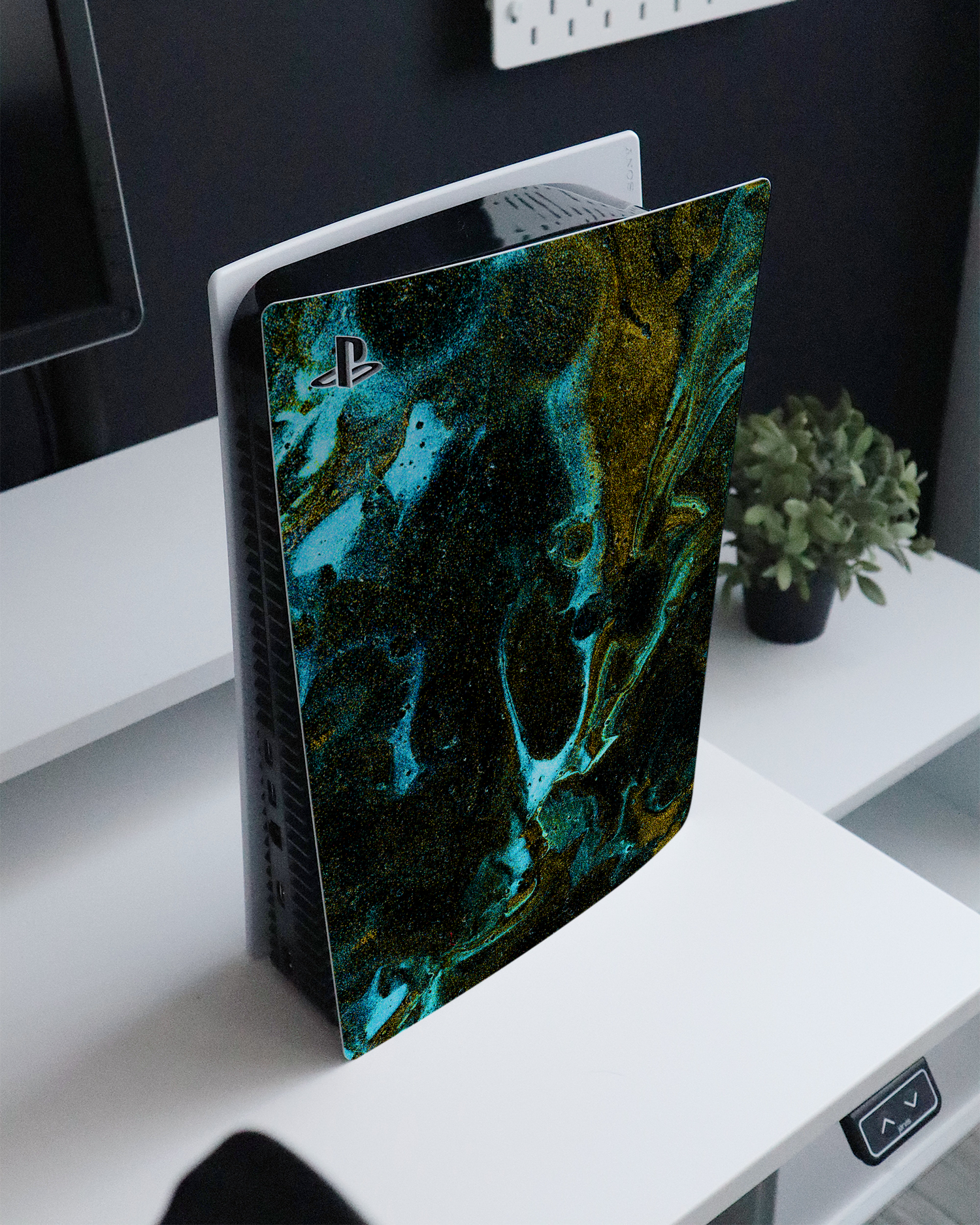 Mint Gold Marble Sparkle Console Skin for Sony PlayStation 5 standing on a sideboard 