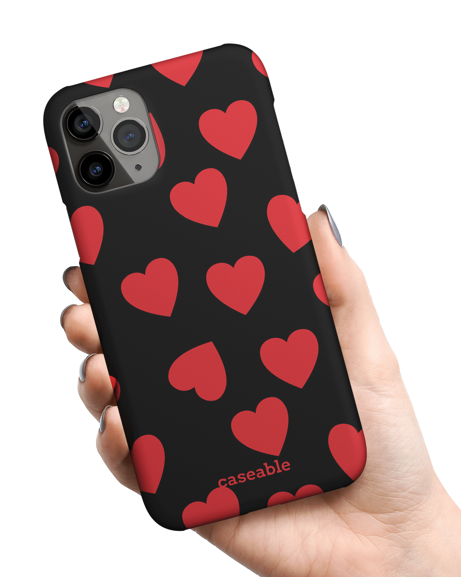 Repeating Hearts Hard Shell Phone Case Apple iPhone 11 Pro Max held in hand
