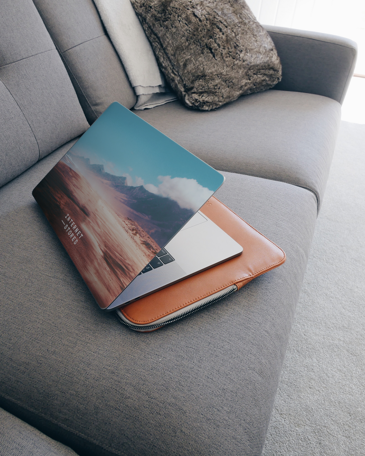 Sky Laptop Skin for 15 inch Apple MacBooks on a couch