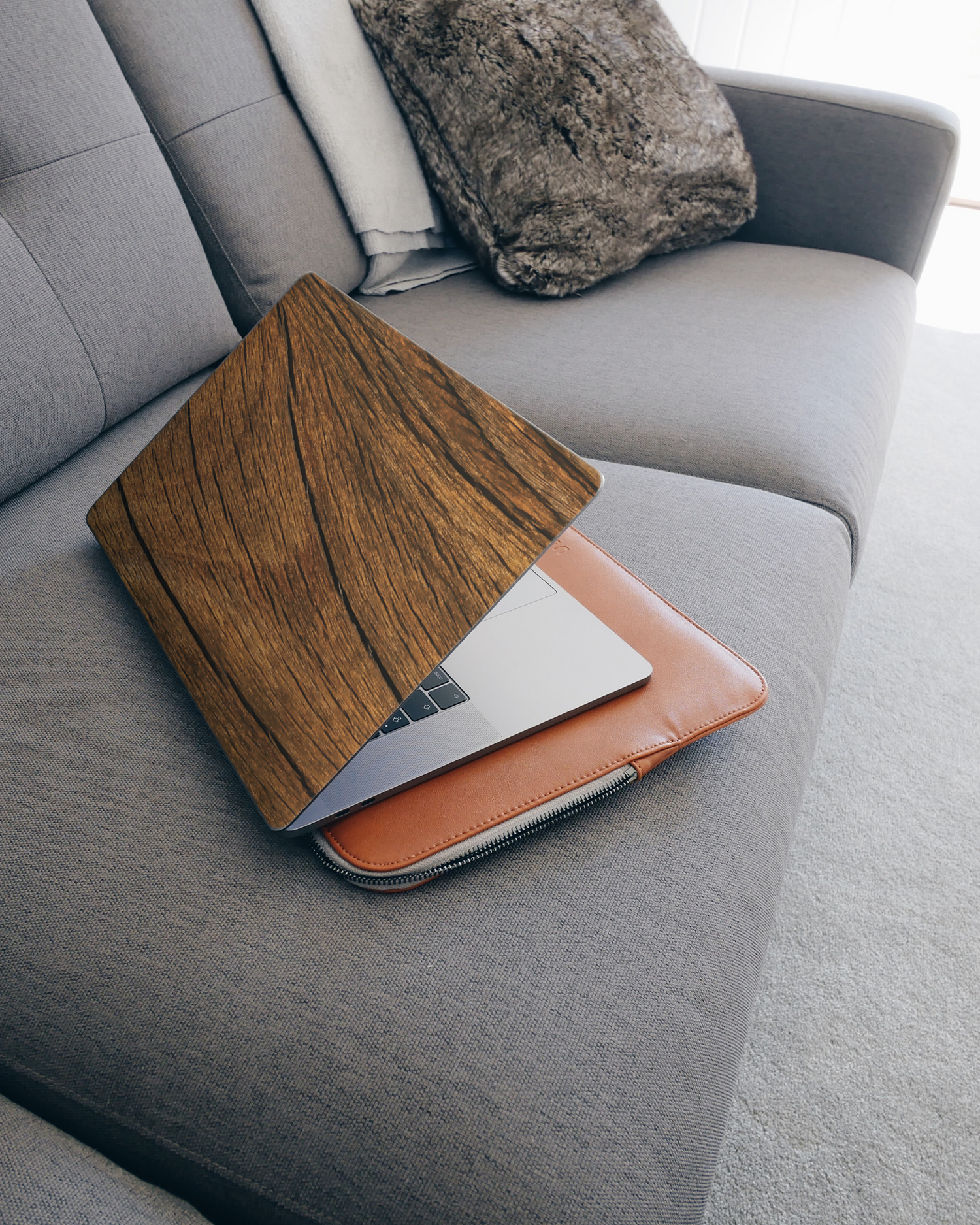 Wood Laptop Skin for 15 inch Apple MacBooks on a couch