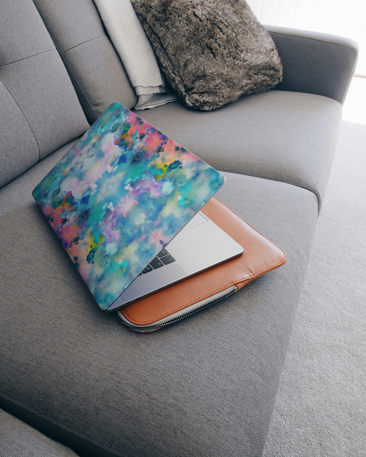 Paint Splatter Laptop Skin for 15 inch Apple MacBooks on a couch