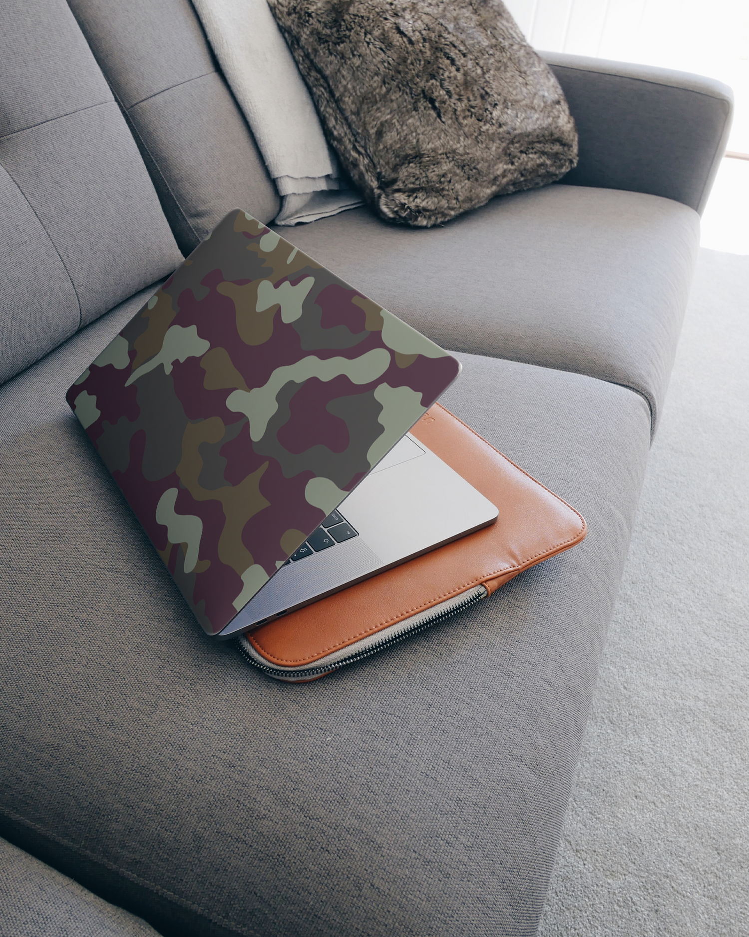 Night Camo Laptop Skin for 15 inch Apple MacBooks on a couch
