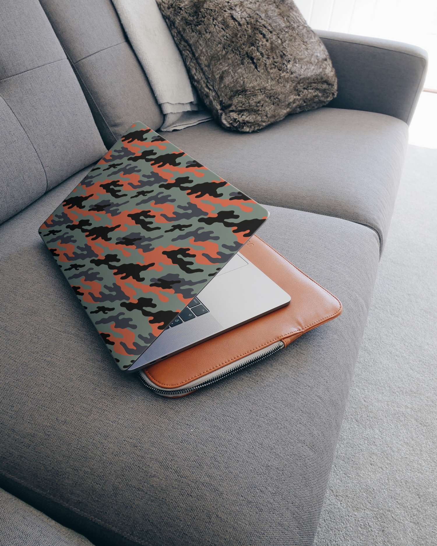 Camo Sunset Laptop Skin for 15 inch Apple MacBooks on a couch