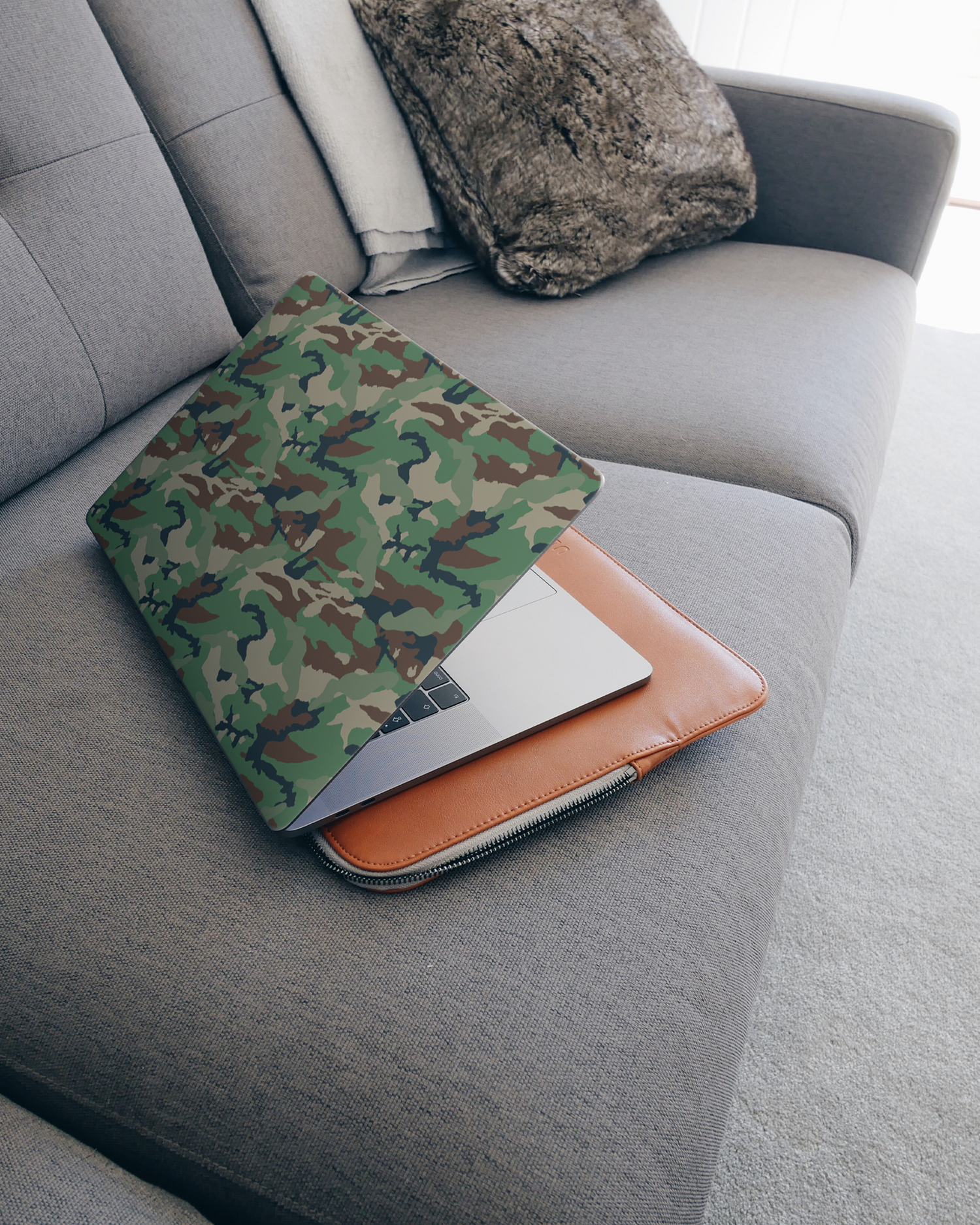 Green and Brown Camo Laptop Skin for 15 inch Apple MacBooks on a couch