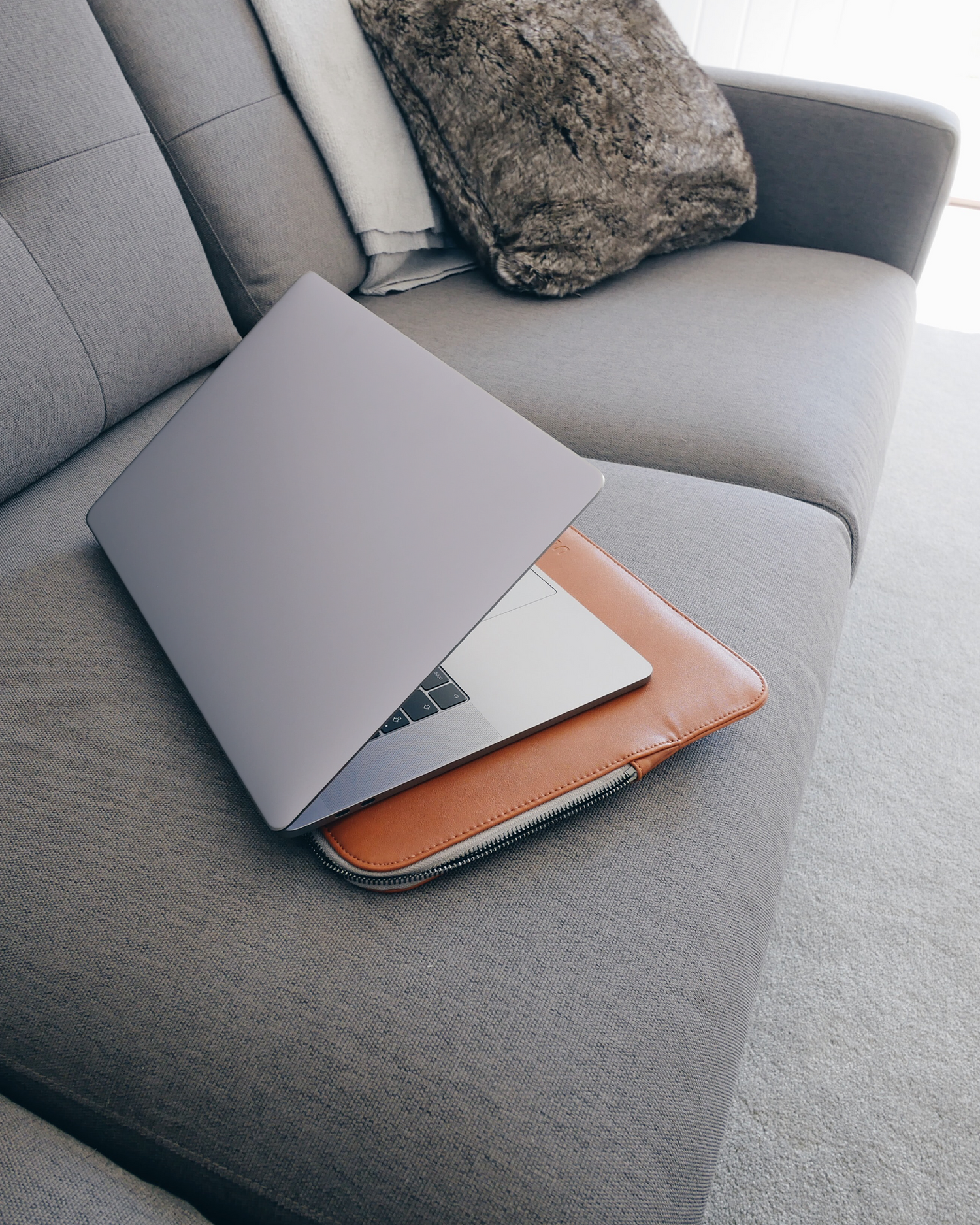 LIGHT PURPLE Laptop Skin for 15 inch Apple MacBooks on a couch