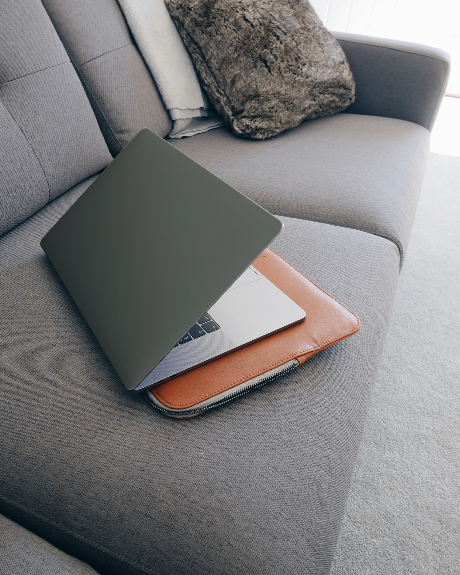 MIDNIGHT GREEN Laptop Skin for 15 inch Apple MacBooks on a couch