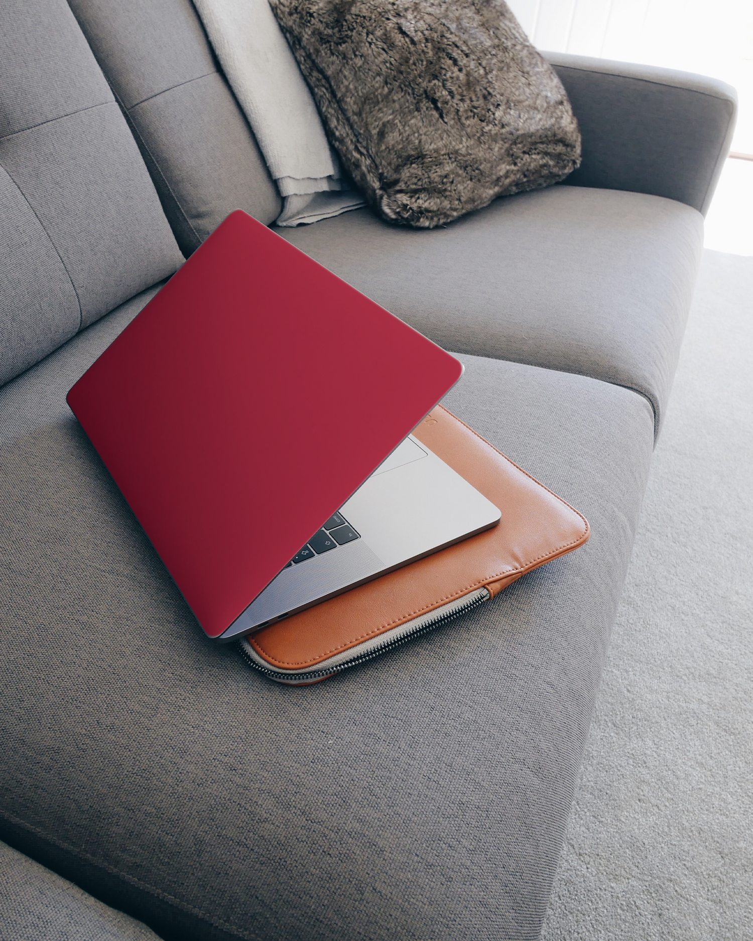 RED Laptop Skin for 15 inch Apple MacBooks on a couch