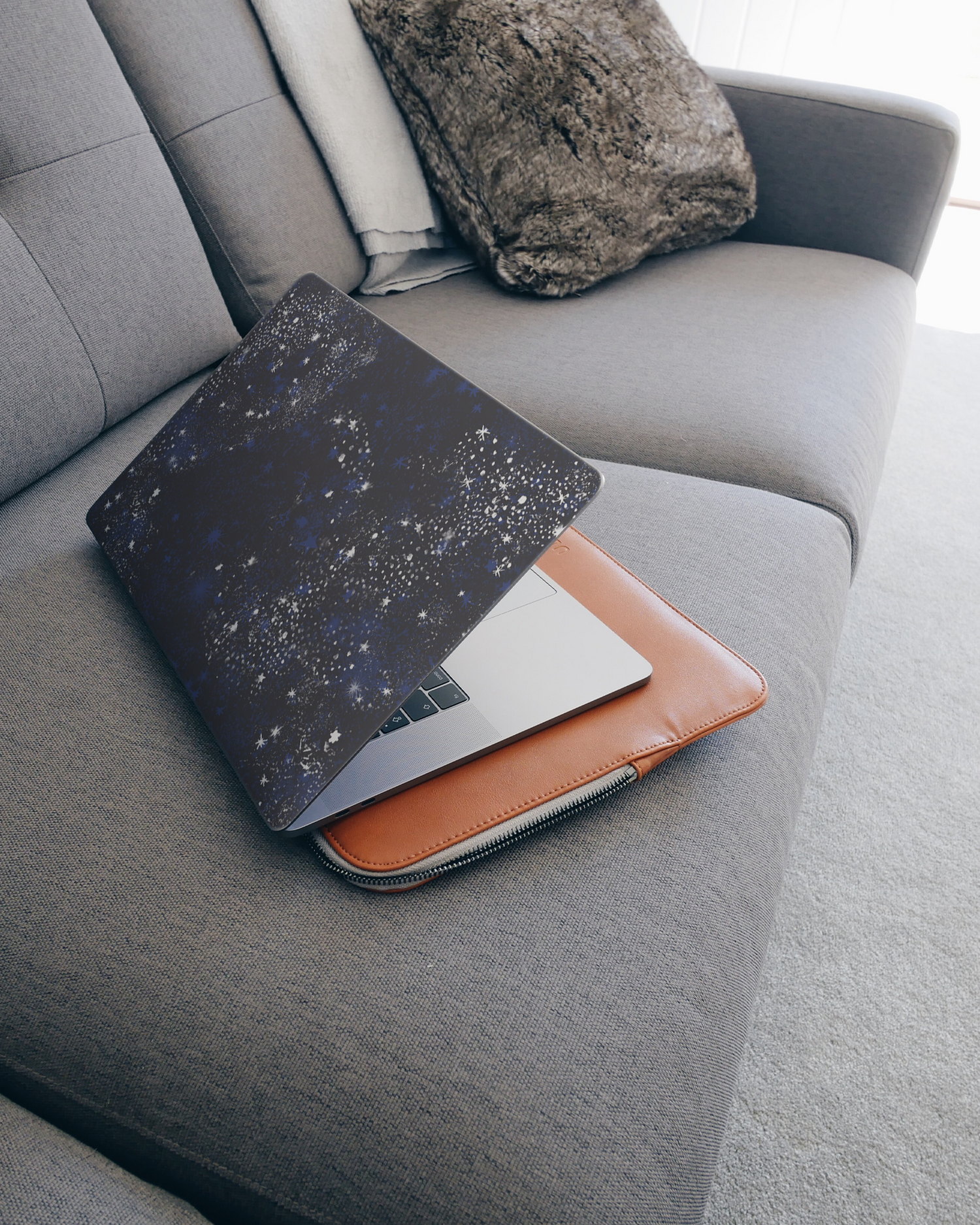 Starry Night Sky Laptop Skin for 15 inch Apple MacBooks on a couch