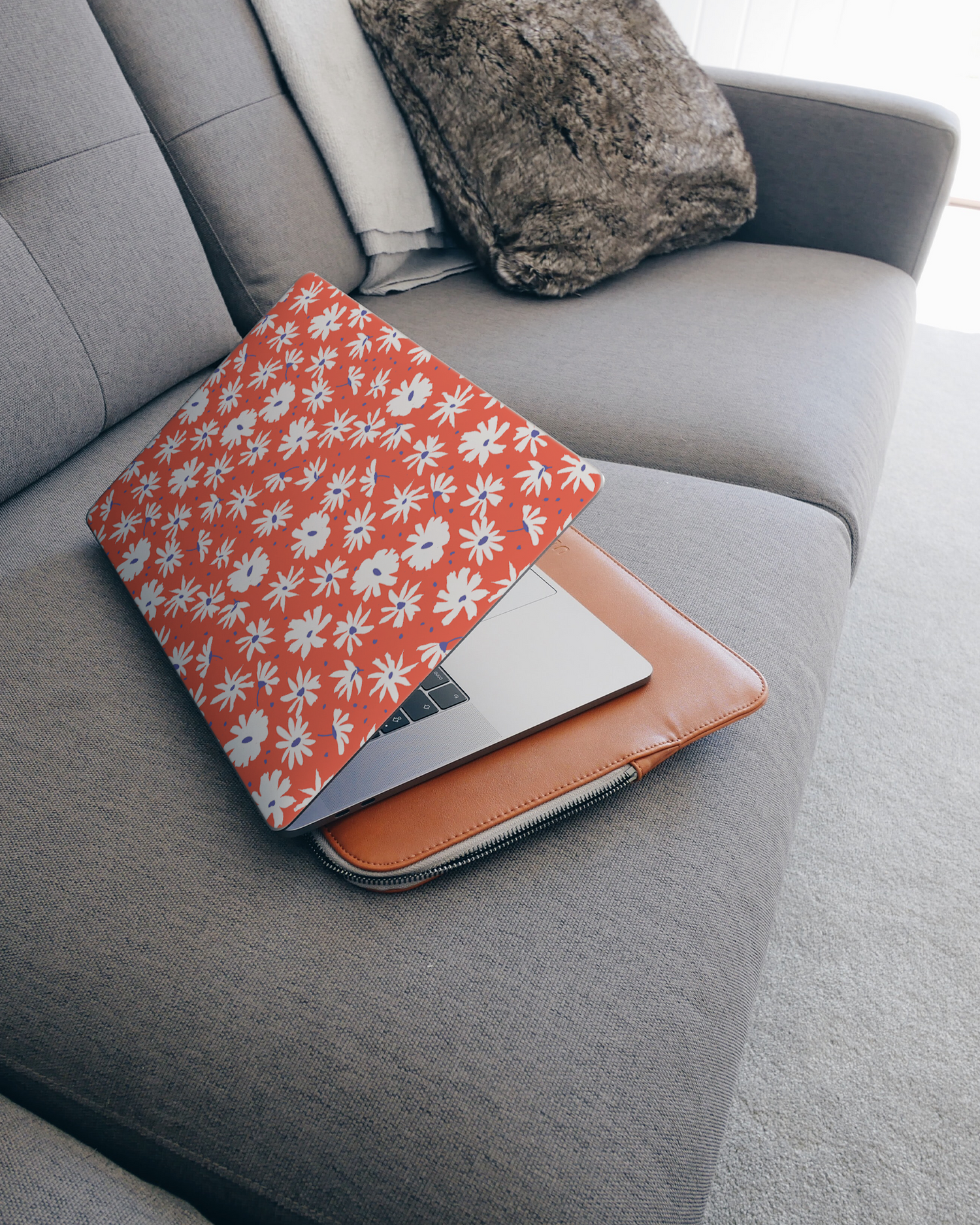 Retro Daisy Laptop Skin for 15 inch Apple MacBooks on a couch