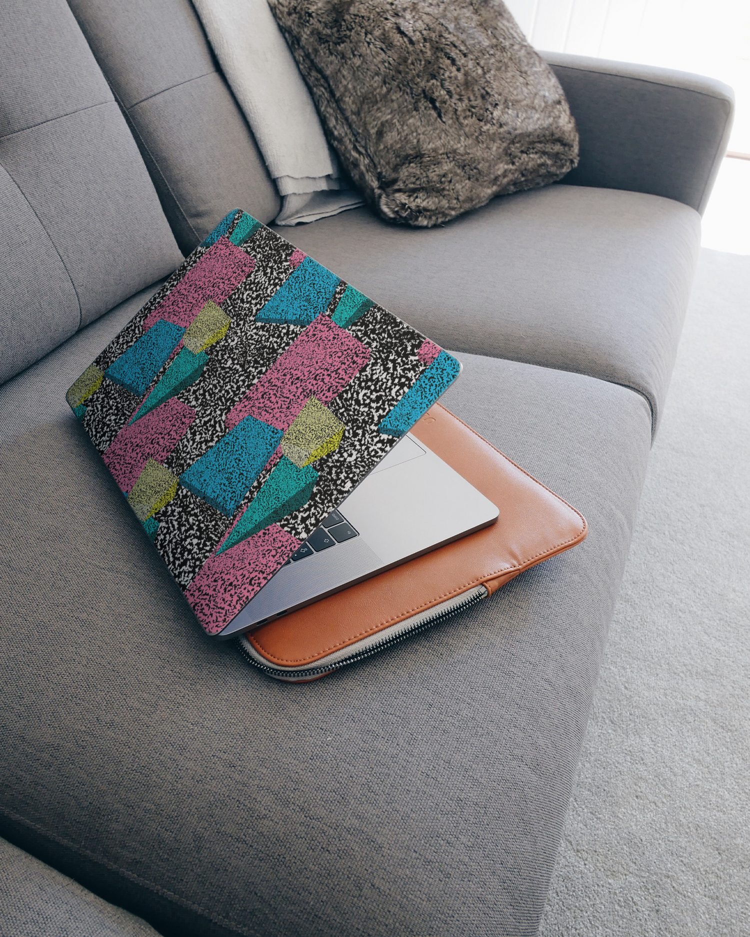 Late Eighties Laptop Skin for 15 inch Apple MacBooks on a couch