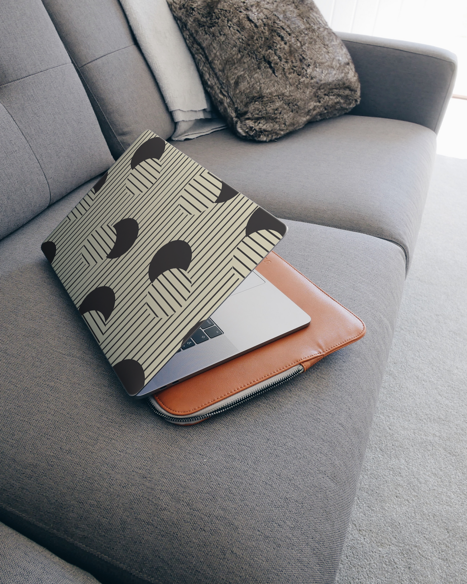 Dot Optics Laptop Skin for 15 inch Apple MacBooks on a couch