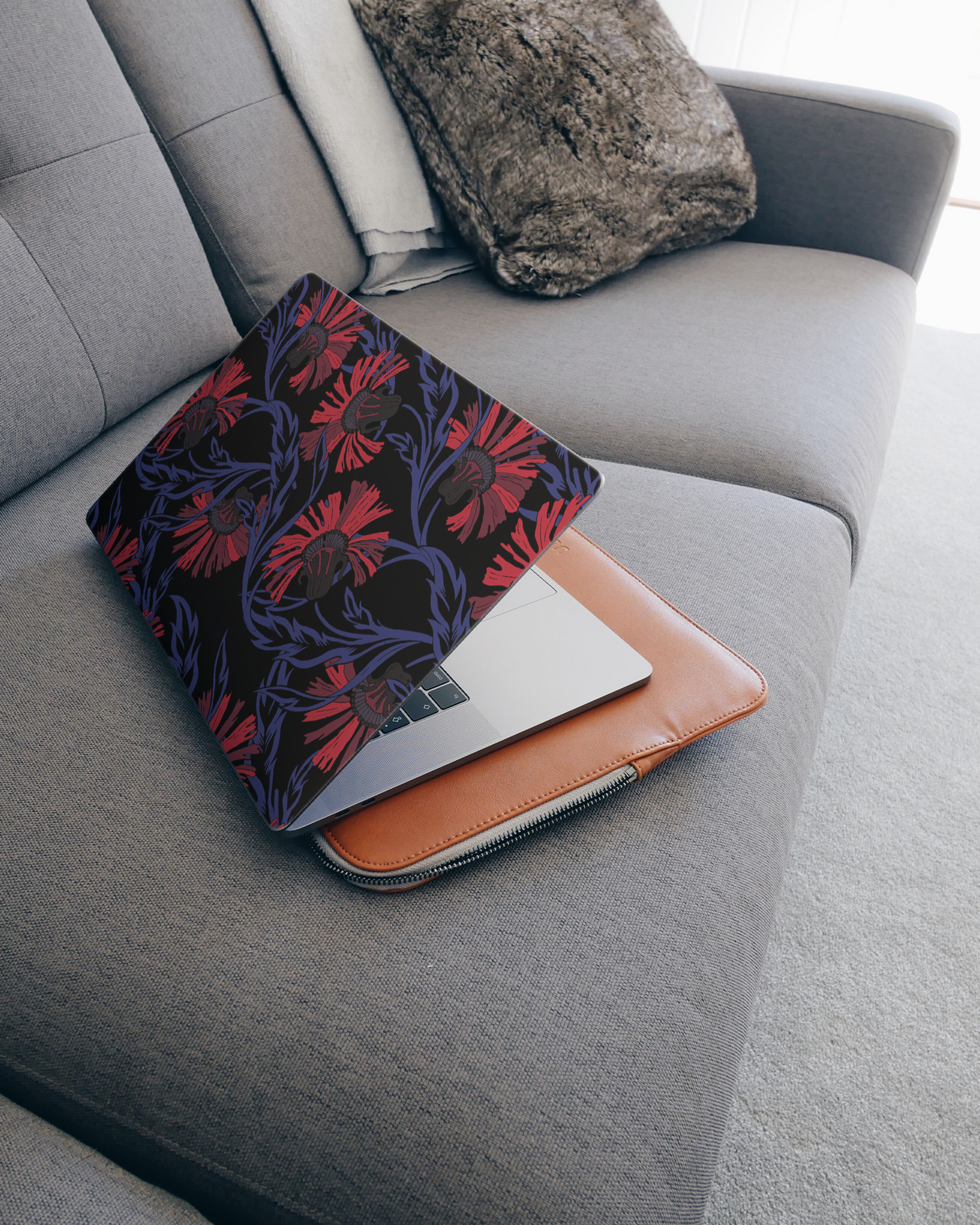 Midnight Floral Laptop Skin for 15 inch Apple MacBooks on a couch