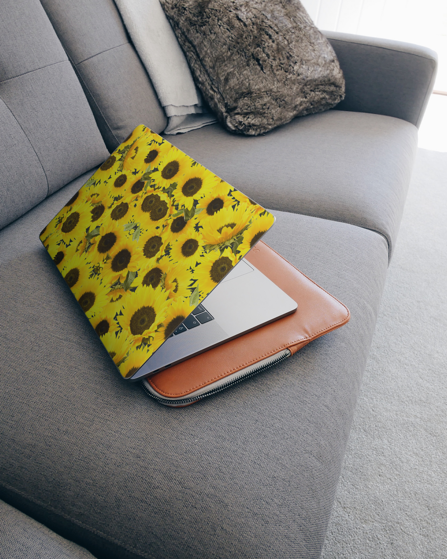 Sunflowers Laptop Skin for 15 inch Apple MacBooks on a couch