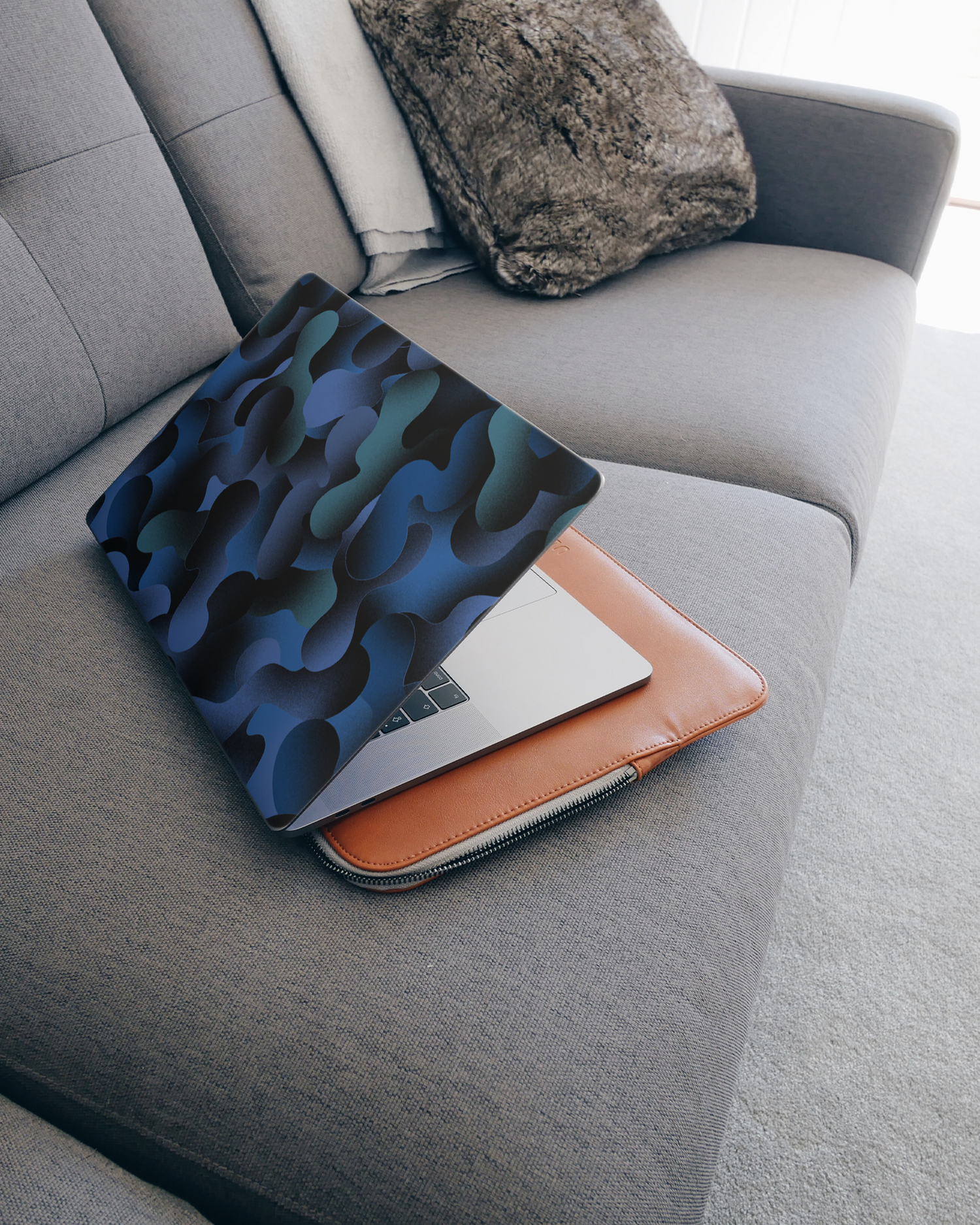 Night Moves Laptop Skin for 15 inch Apple MacBooks on a couch
