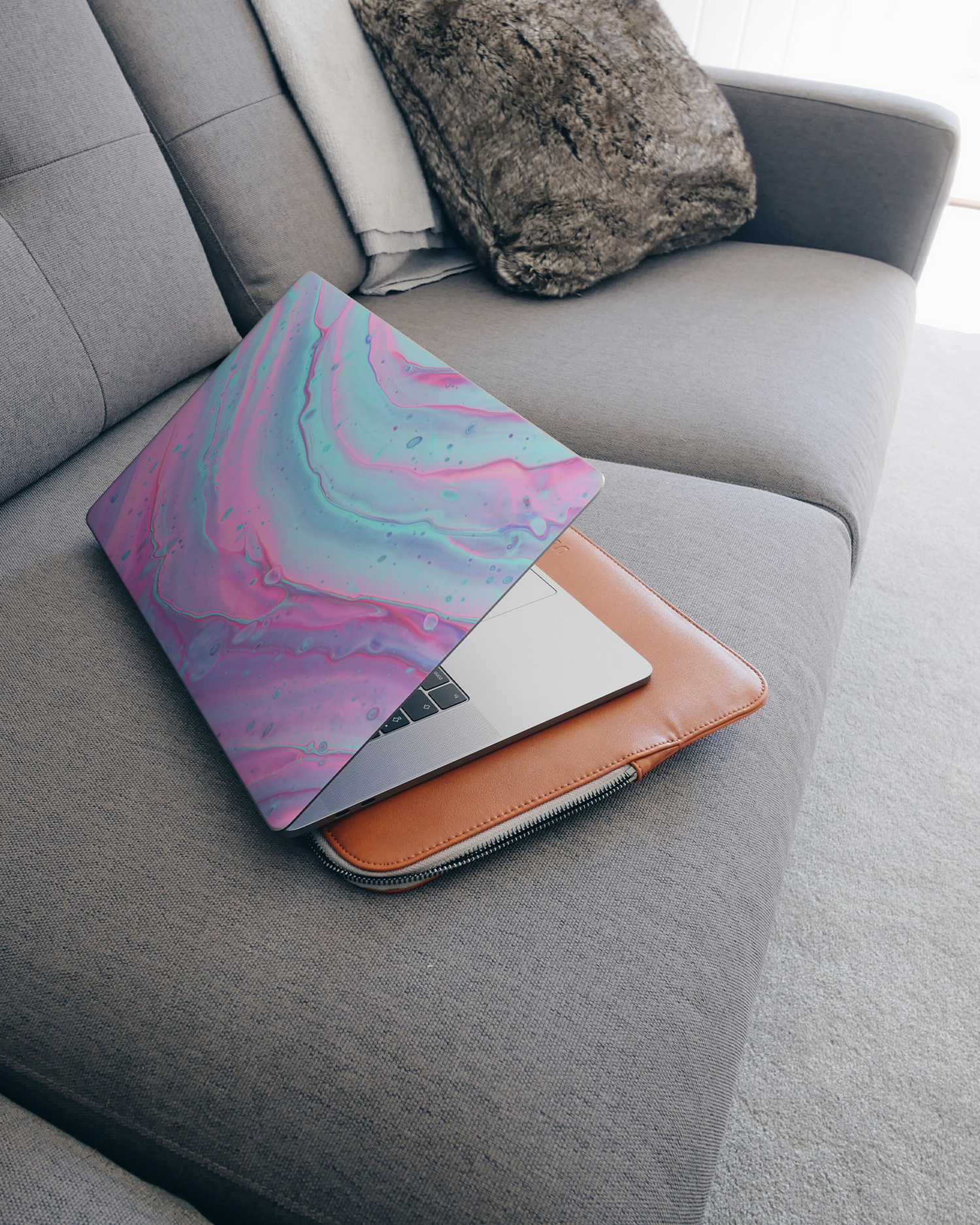 Wavey Laptop Skin for 15 inch Apple MacBooks on a couch