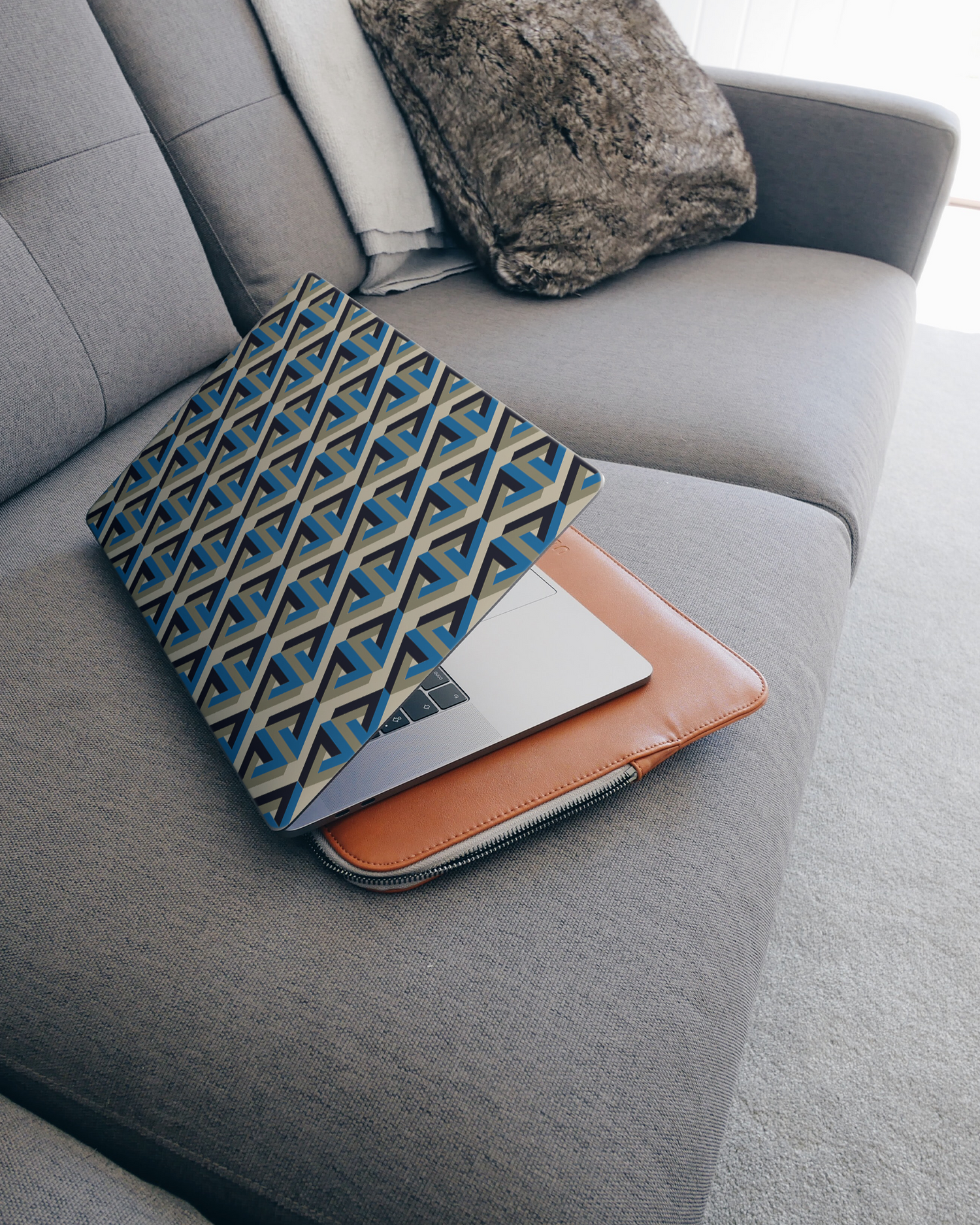 Penrose Pattern Laptop Skin for 15 inch Apple MacBooks on a couch