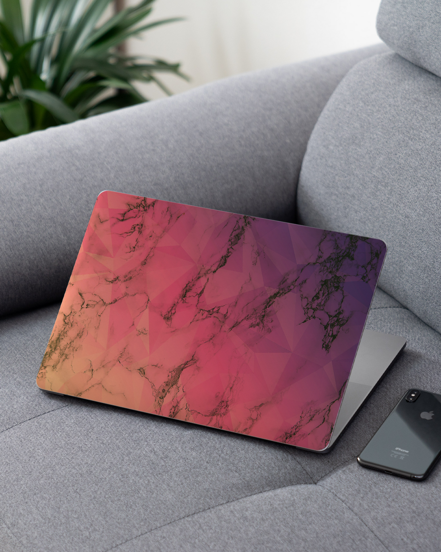 Marbled Triangles Laptop Skin for 13 inch Apple MacBooks on a couch
