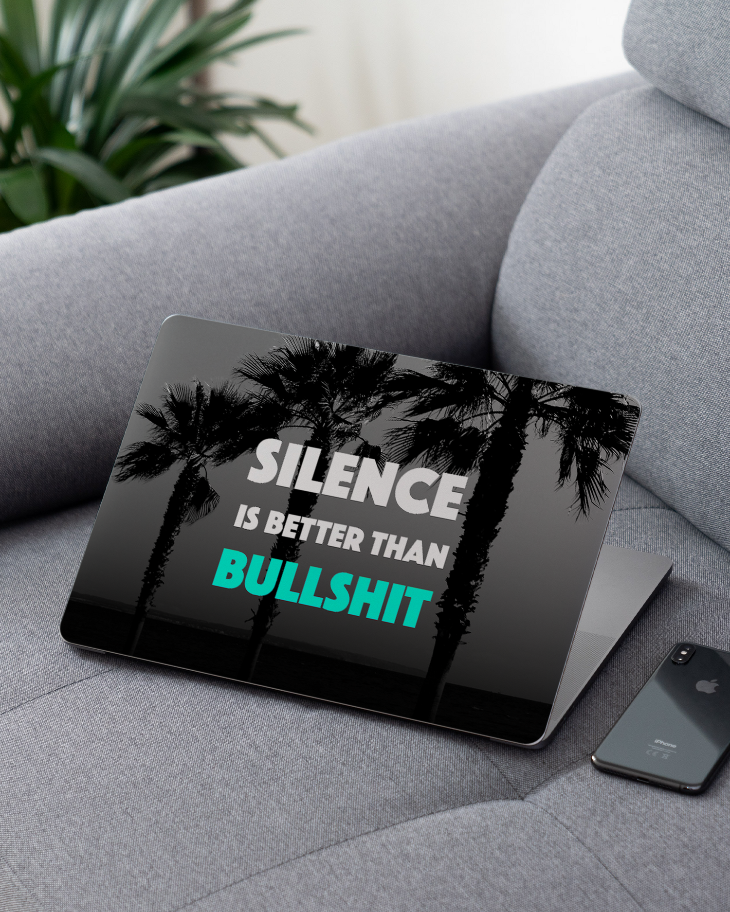 Silence Is Better Laptop Skin for 13 inch Apple MacBooks on a couch