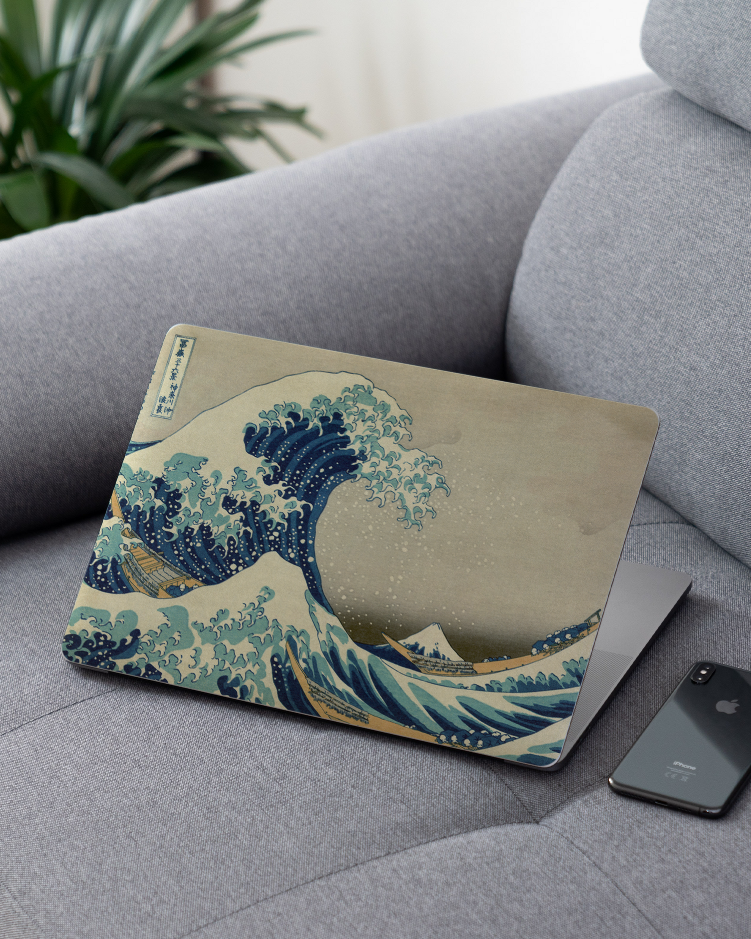 Great Wave Off Kanagawa By Hokusai Laptop Skin for 13 inch Apple MacBooks on a couch