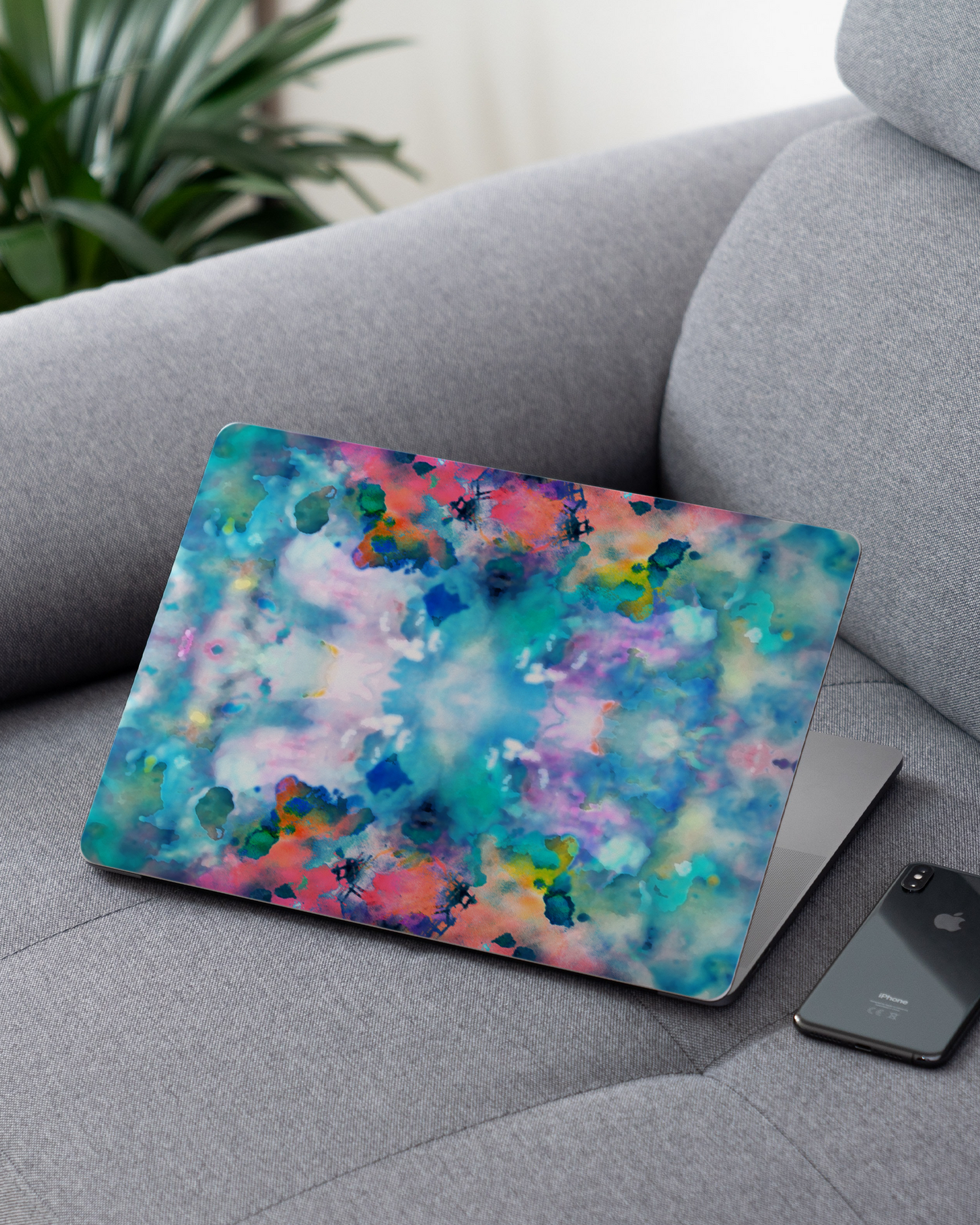 Paint Splatter Laptop Skin for 13 inch Apple MacBooks on a couch