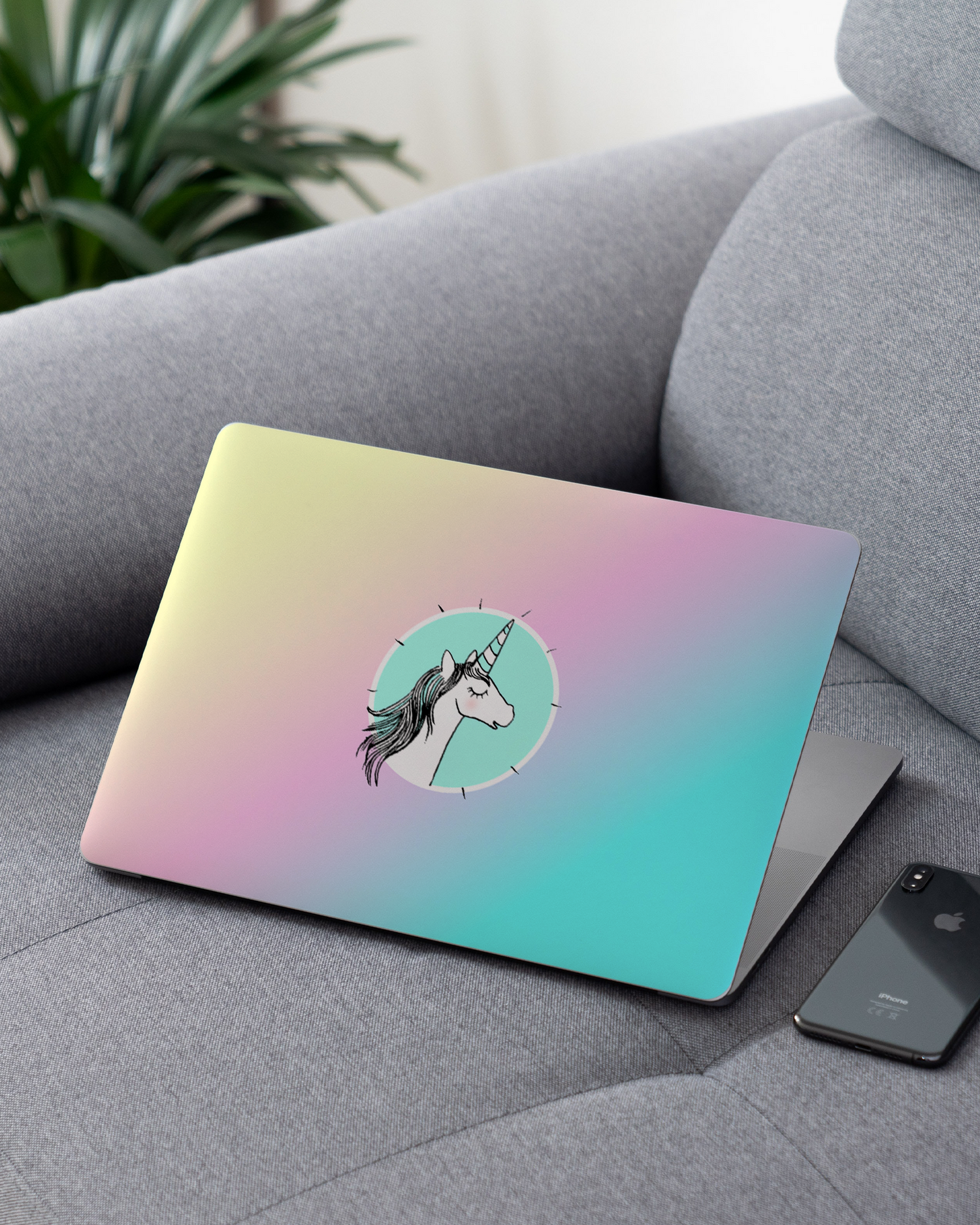 Happiness Unicorn Laptop Skin for 13 inch Apple MacBooks on a couch
