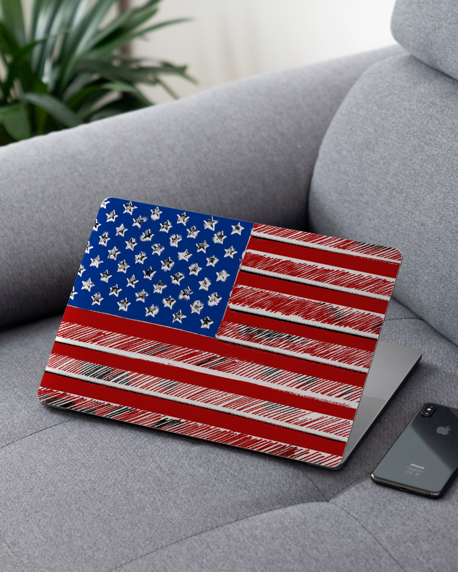 American Flag Color Laptop Skin for 13 inch Apple MacBooks on a couch