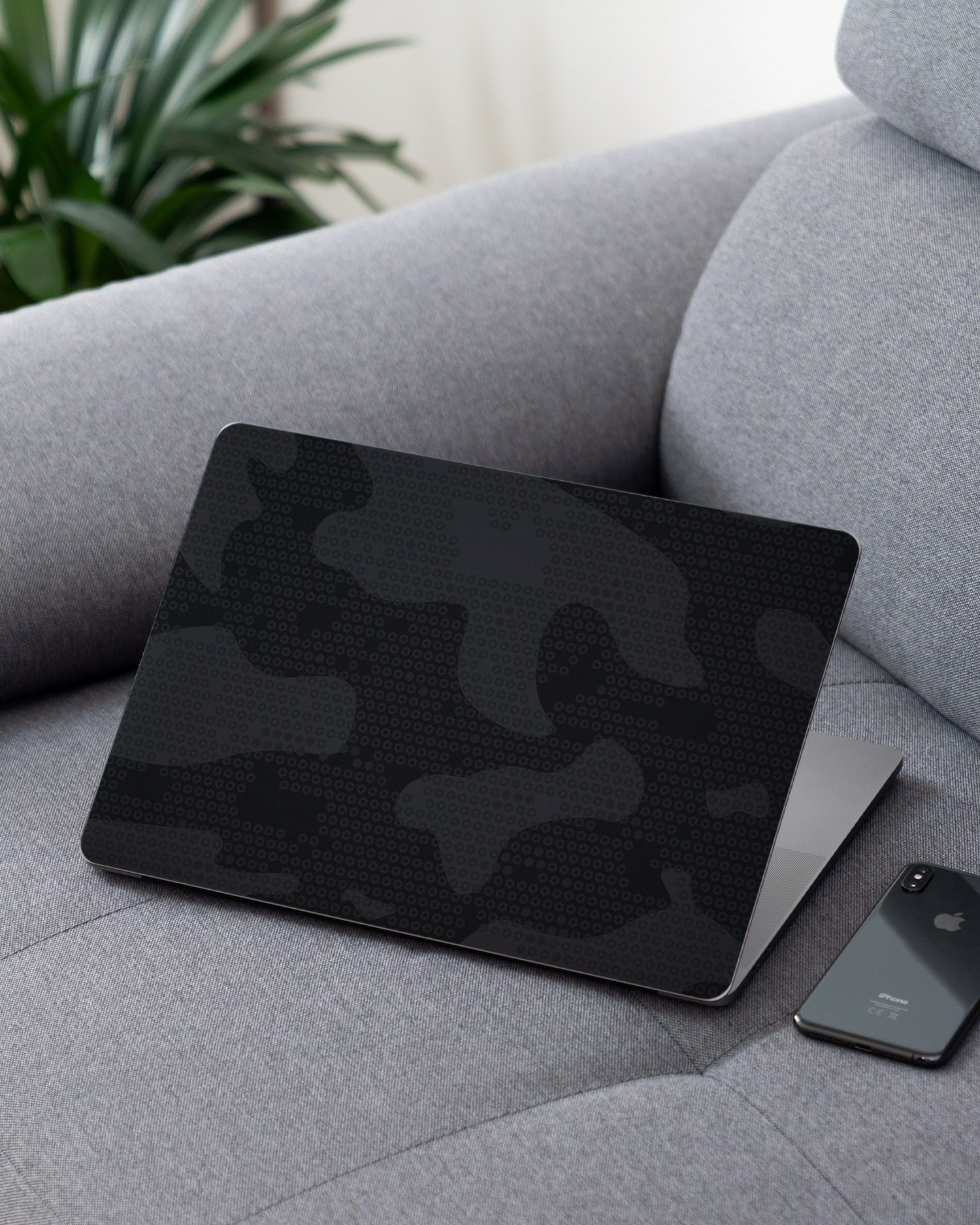 Spec Ops Dark Laptop Skin for 13 inch Apple MacBooks on a couch