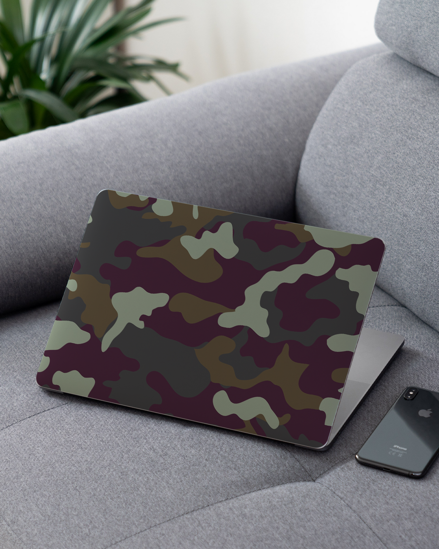 Night Camo Laptop Skin for 13 inch Apple MacBooks on a couch