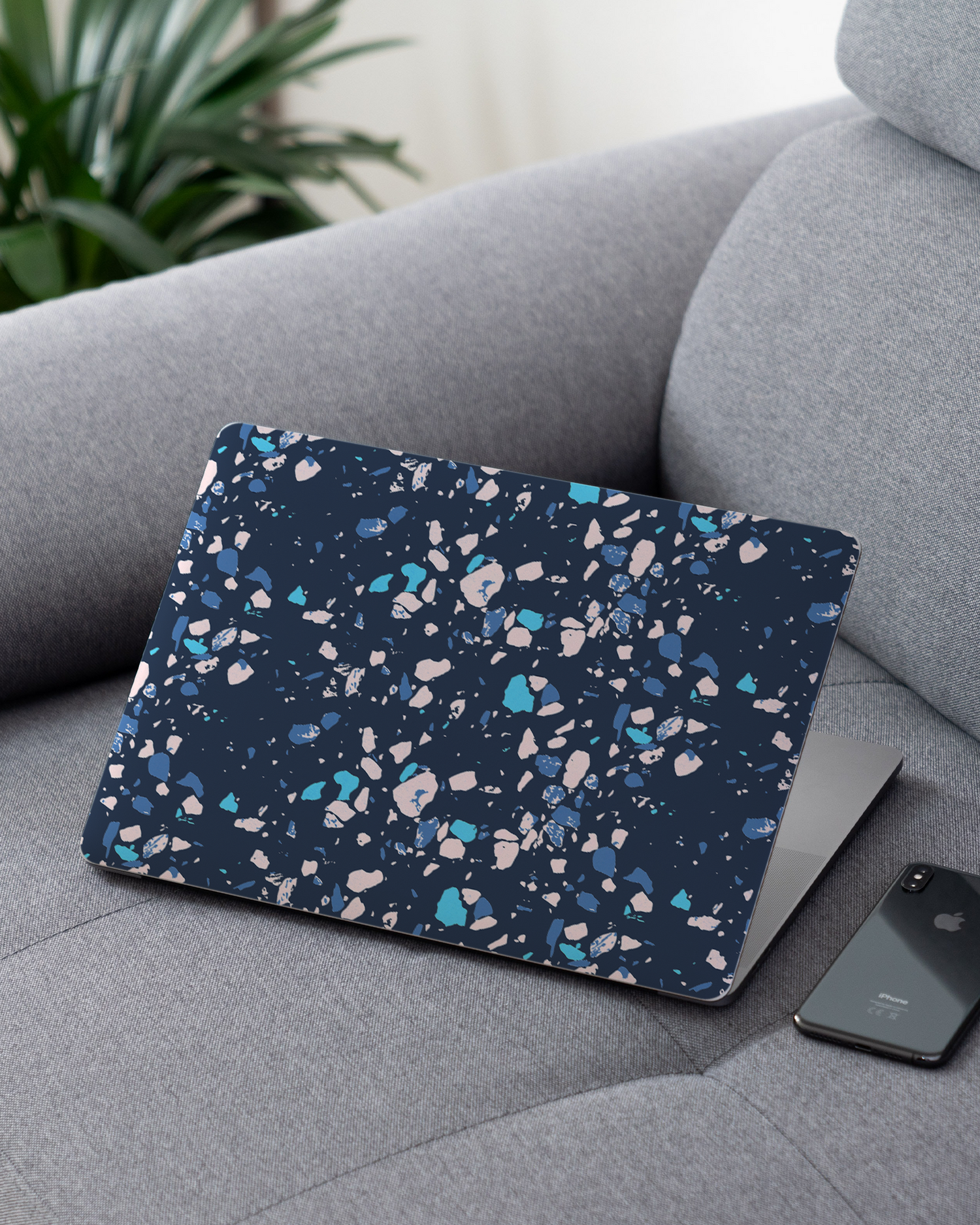 Speckled Marble Laptop Skin for 13 inch Apple MacBooks on a couch