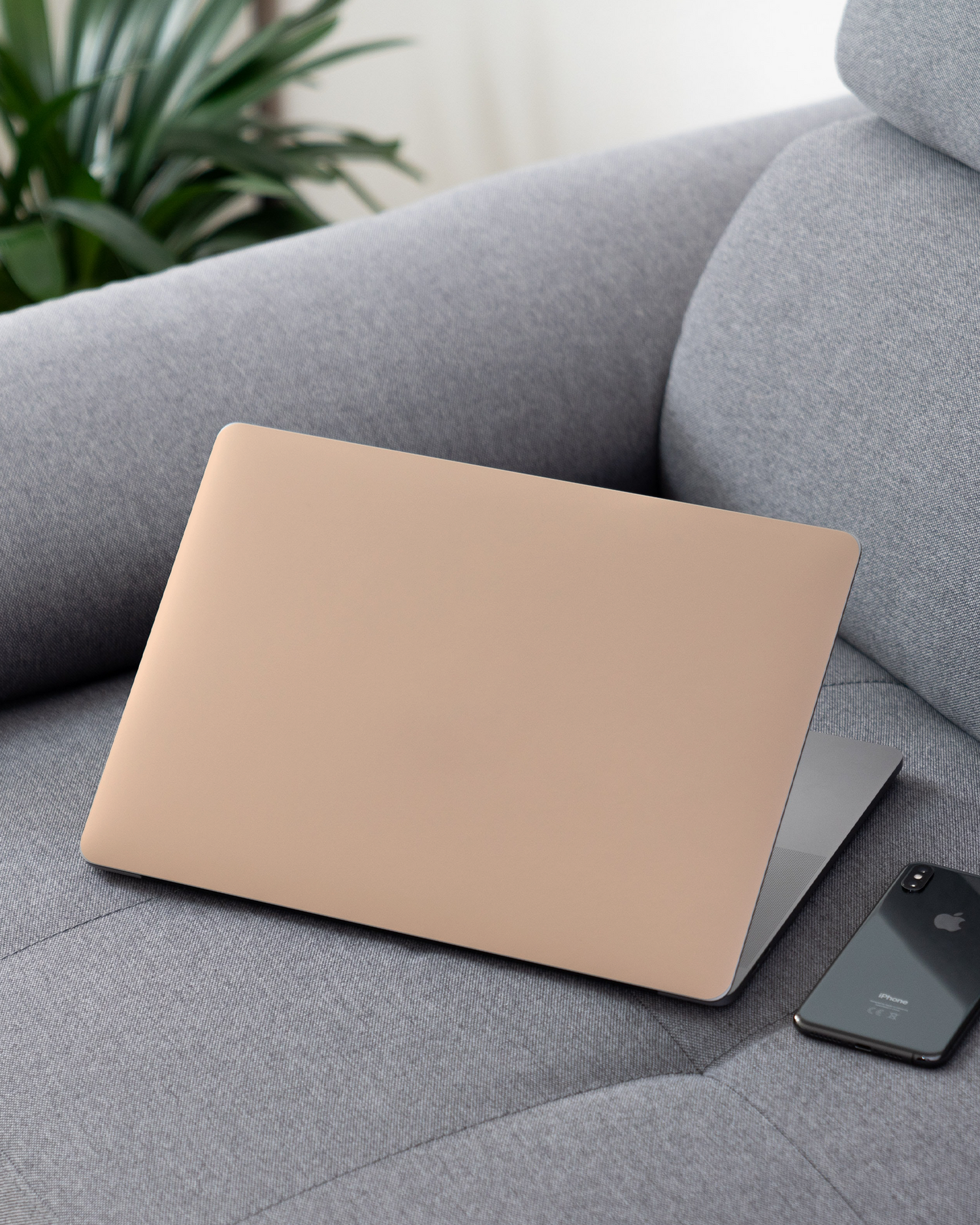 PEACH Laptop Skin for 13 inch Apple MacBooks on a couch