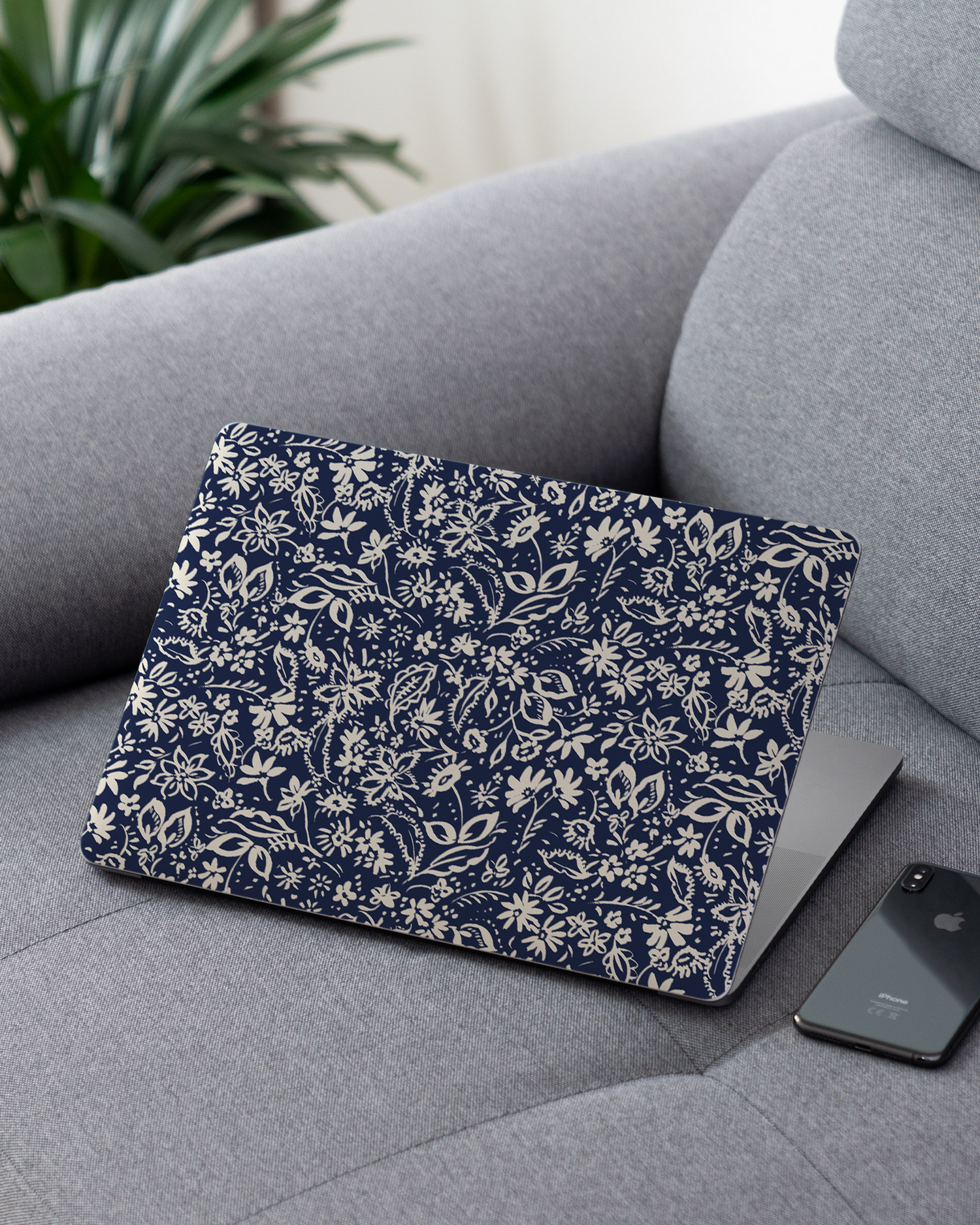 Ditsy Blue Paisley Laptop Skin for 13 inch Apple MacBooks on a couch