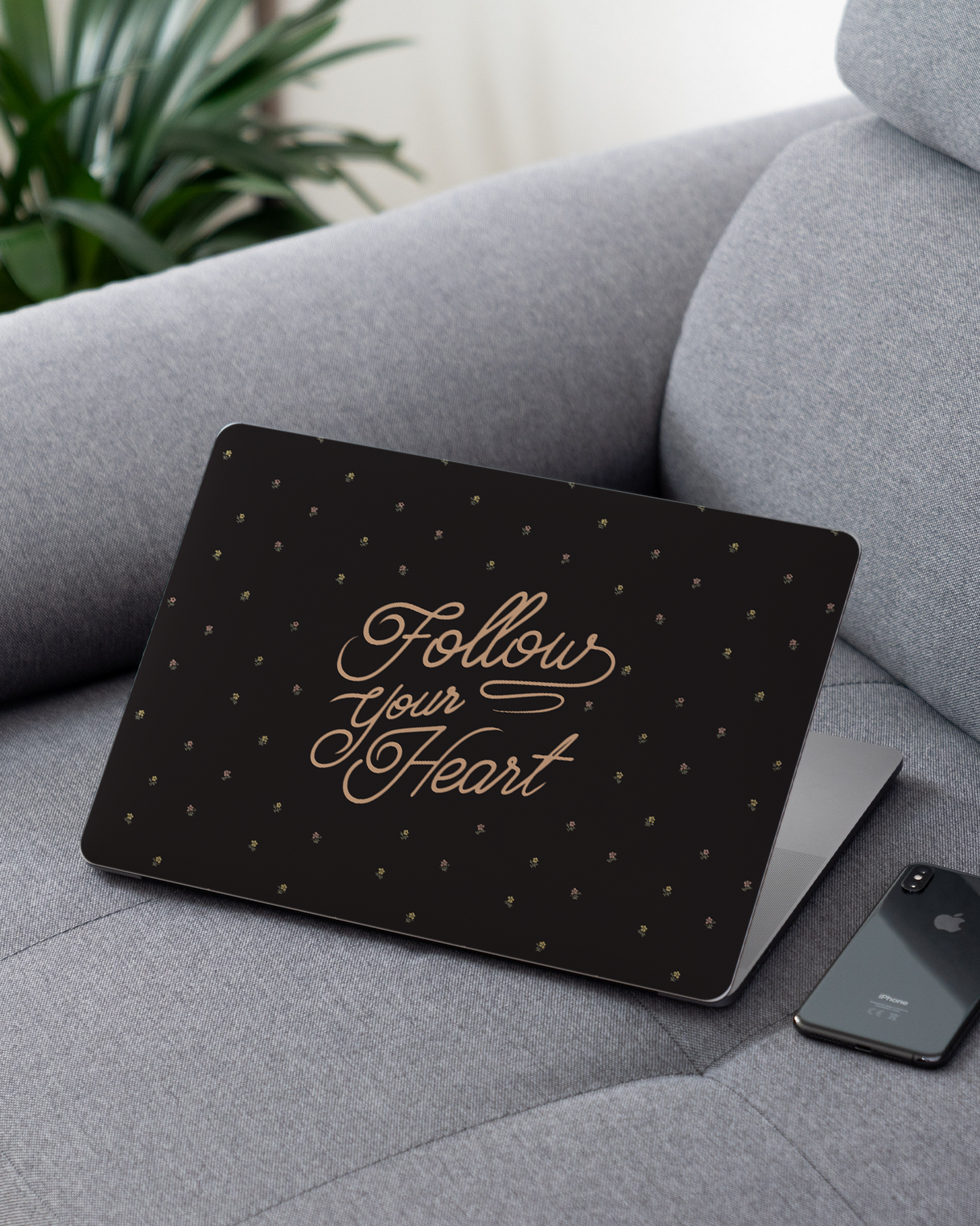 Follow Your Heart Laptop Skin for 13 inch Apple MacBooks on a couch
