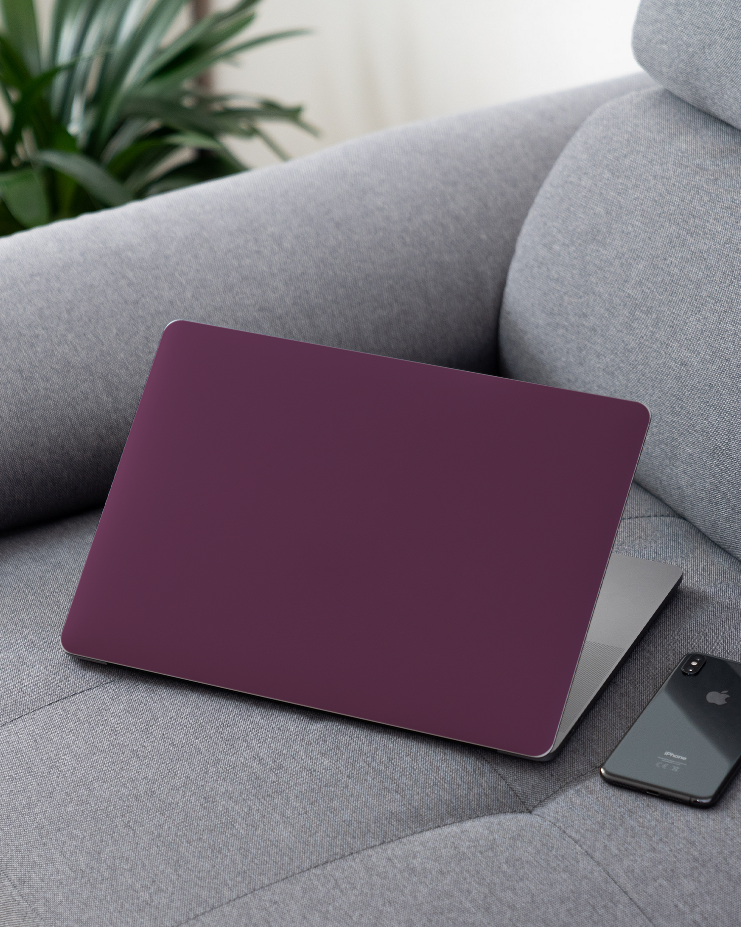 PLUM Laptop Skin for 13 inch Apple MacBooks on a couch