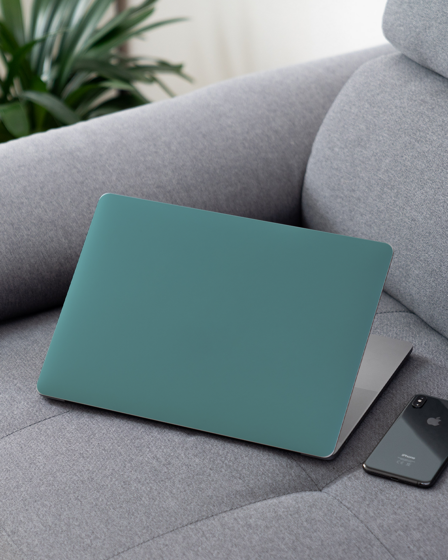 TURQUOISE Laptop Skin for 13 inch Apple MacBooks on a couch