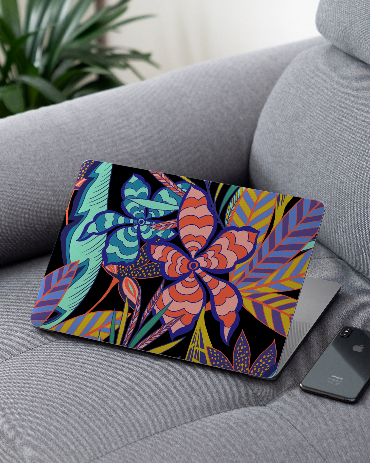 Tropical Psychedelic Pattern Laptop Skin for 13 inch Apple MacBooks on a couch