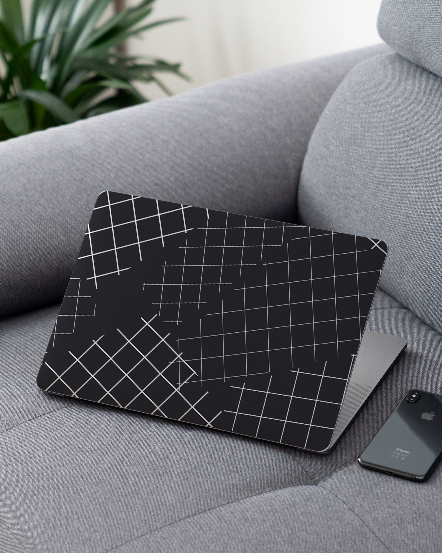 Grids Laptop Skin for 13 inch Apple MacBooks on a couch