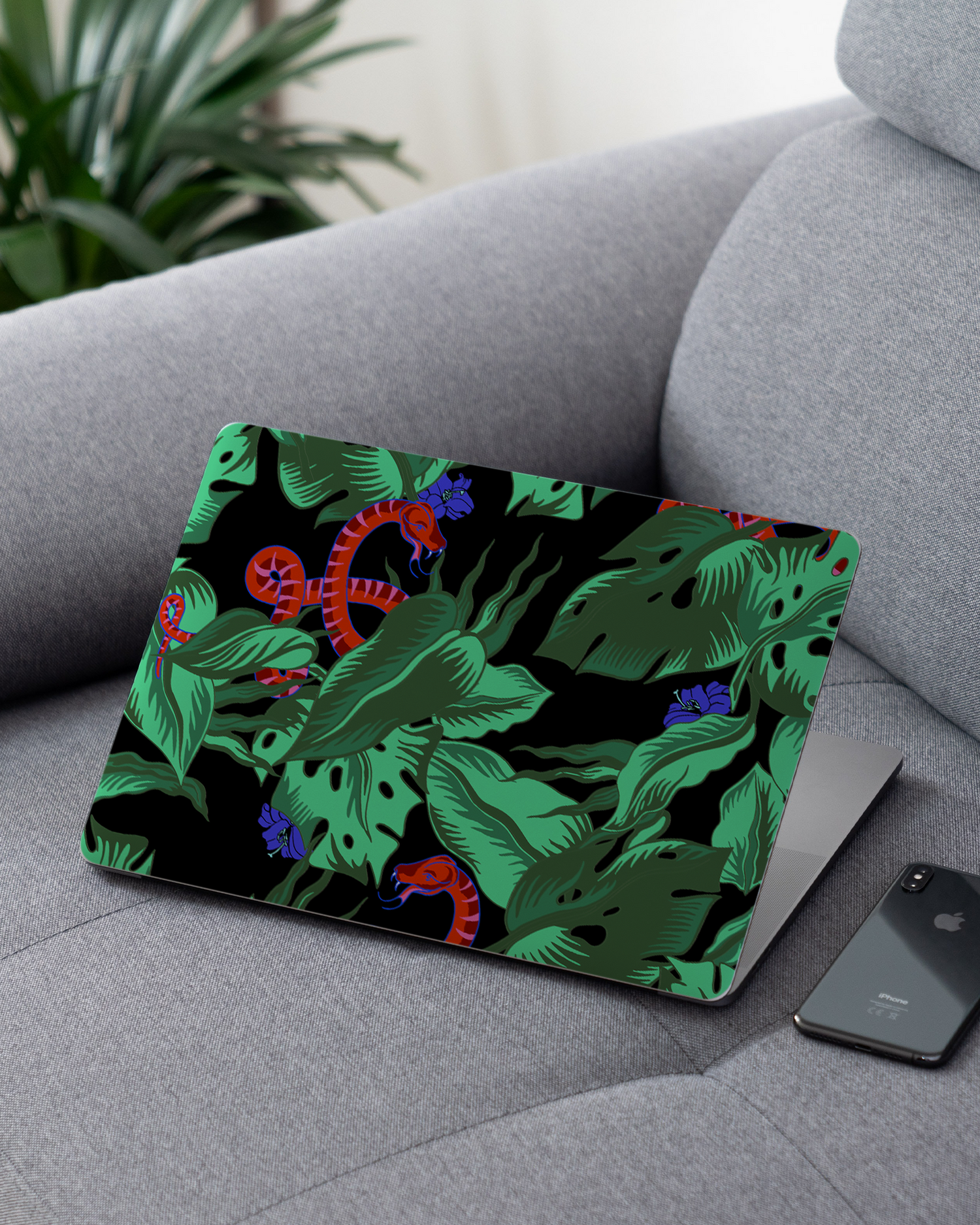 Tropical Snakes Laptop Skin for 13 inch Apple MacBooks on a couch