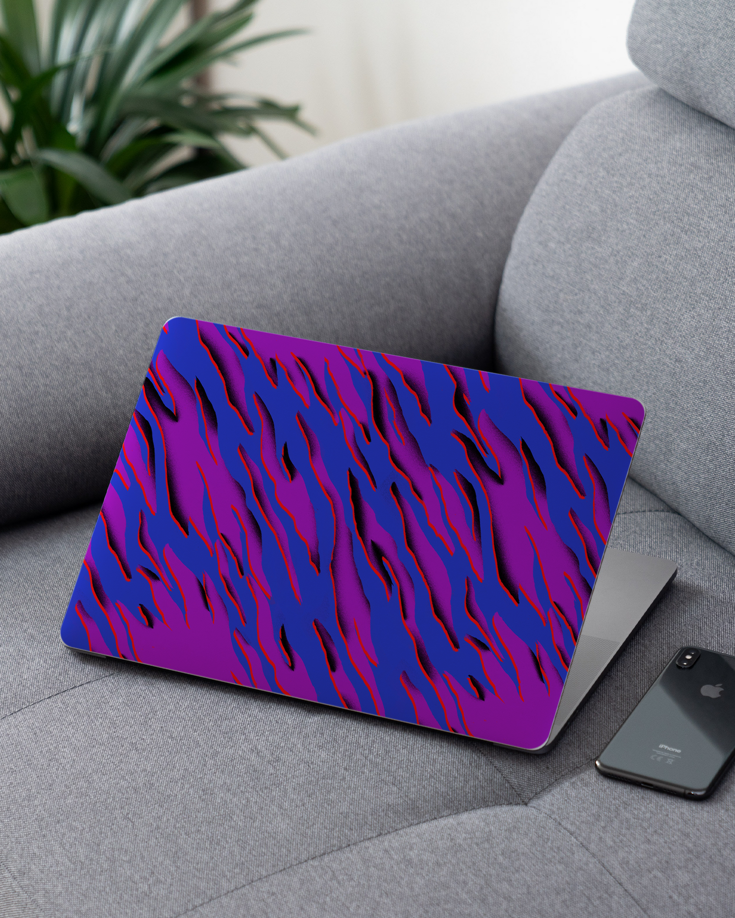 Electric Ocean 2 Laptop Skin for 13 inch Apple MacBooks on a couch